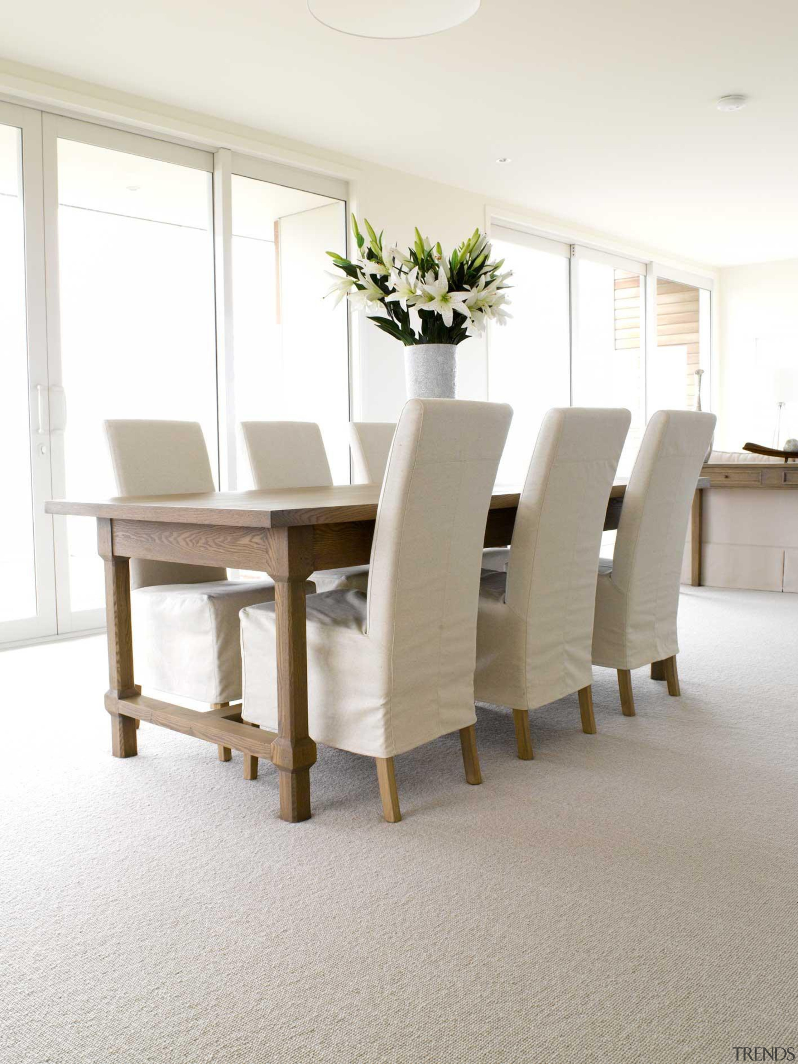 A smartly tailored loop pile carpet offering fantastic chair, dining room, floor, flooring, furniture, interior design, table, white