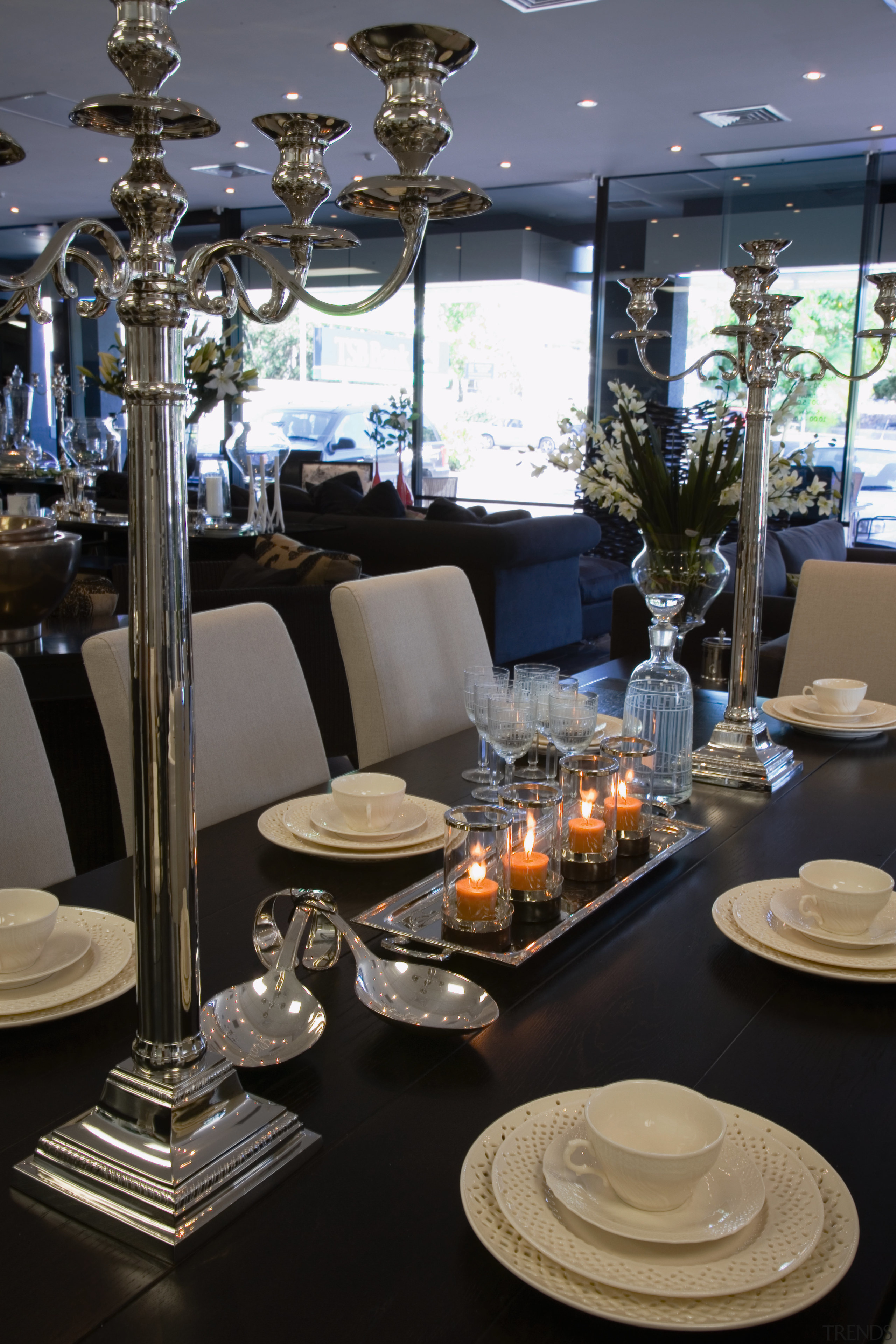 View of showroom with closeup of dining table dining room, furniture, interior design, restaurant, table, black, gray