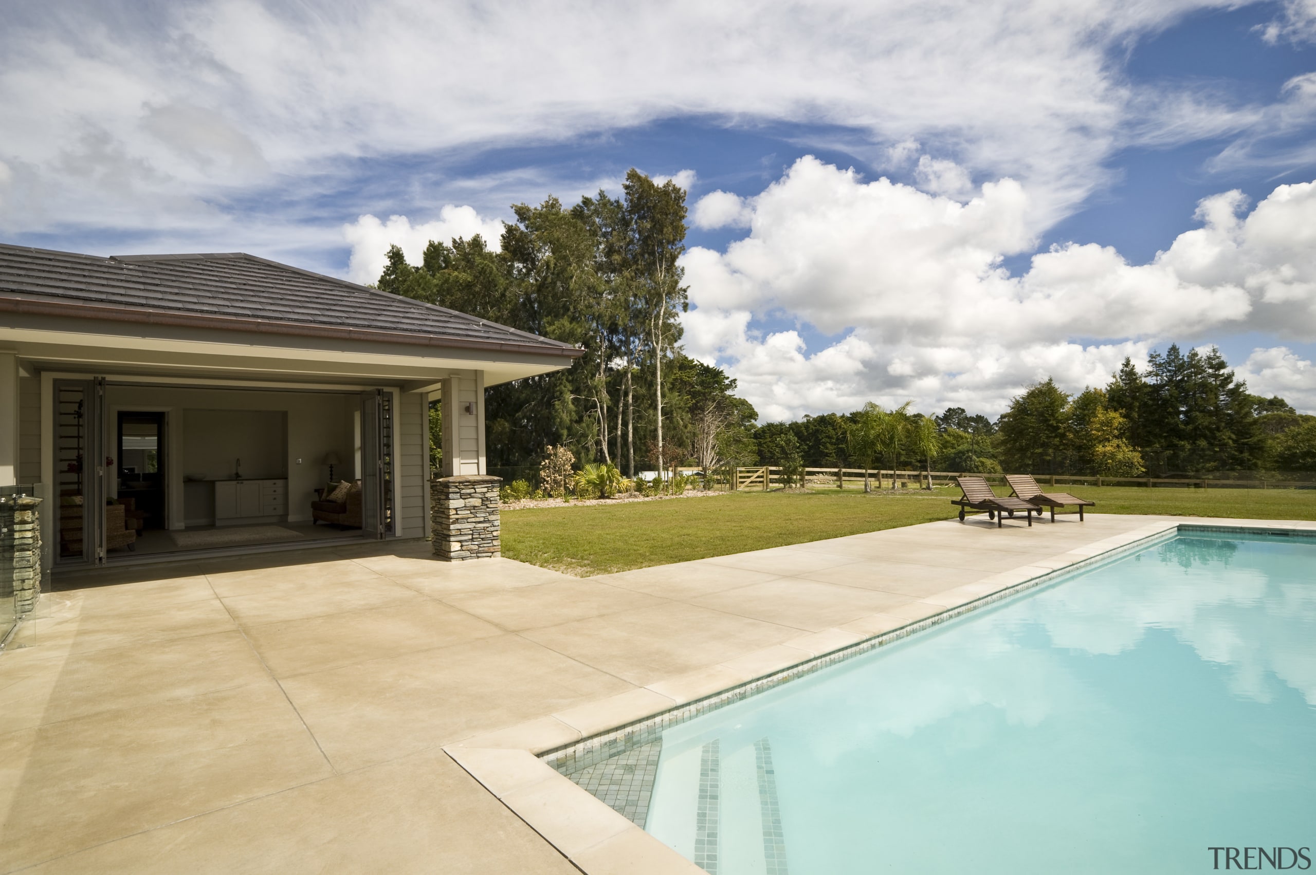 Image of coloured concrete from Peter Fell Ltd backyard, estate, home, house, landscape, property, real estate, residential area, sky, swimming pool, villa