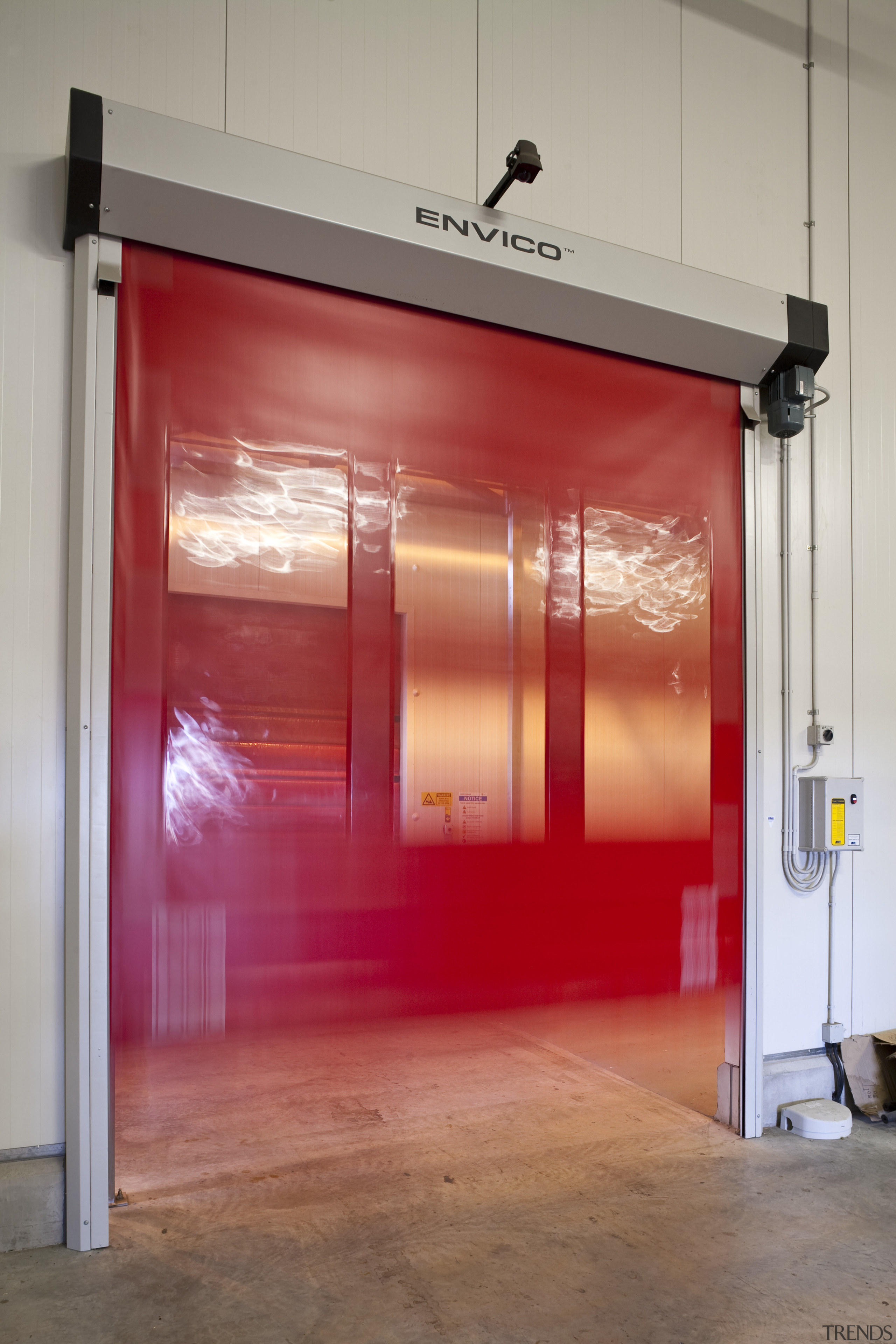 View of the Lion Nathan storage warehouse which door, red, gray, red