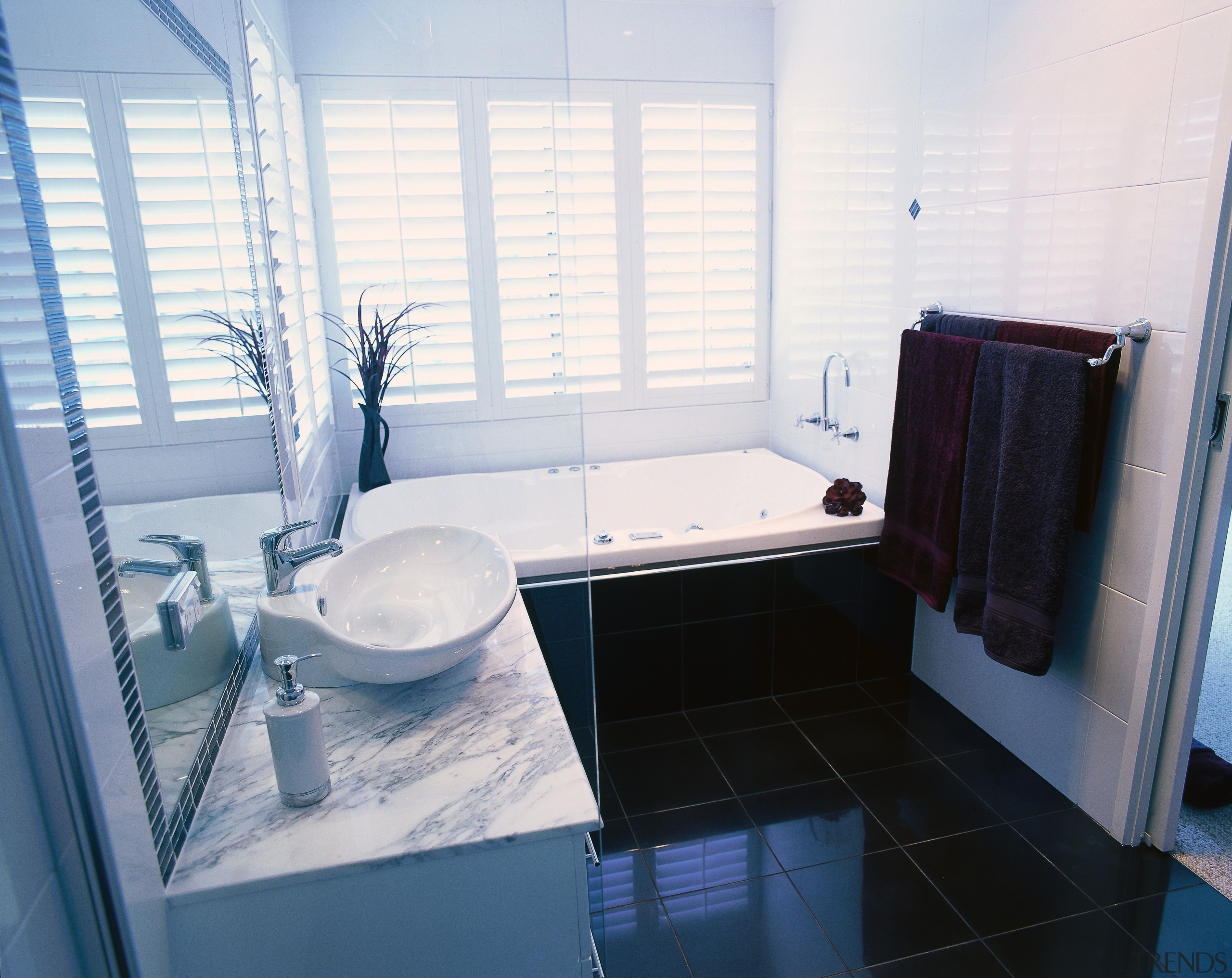 Bathroom with  white walls and black floor bathroom, bathtub, floor, home, house, interior design, property, room, window, white