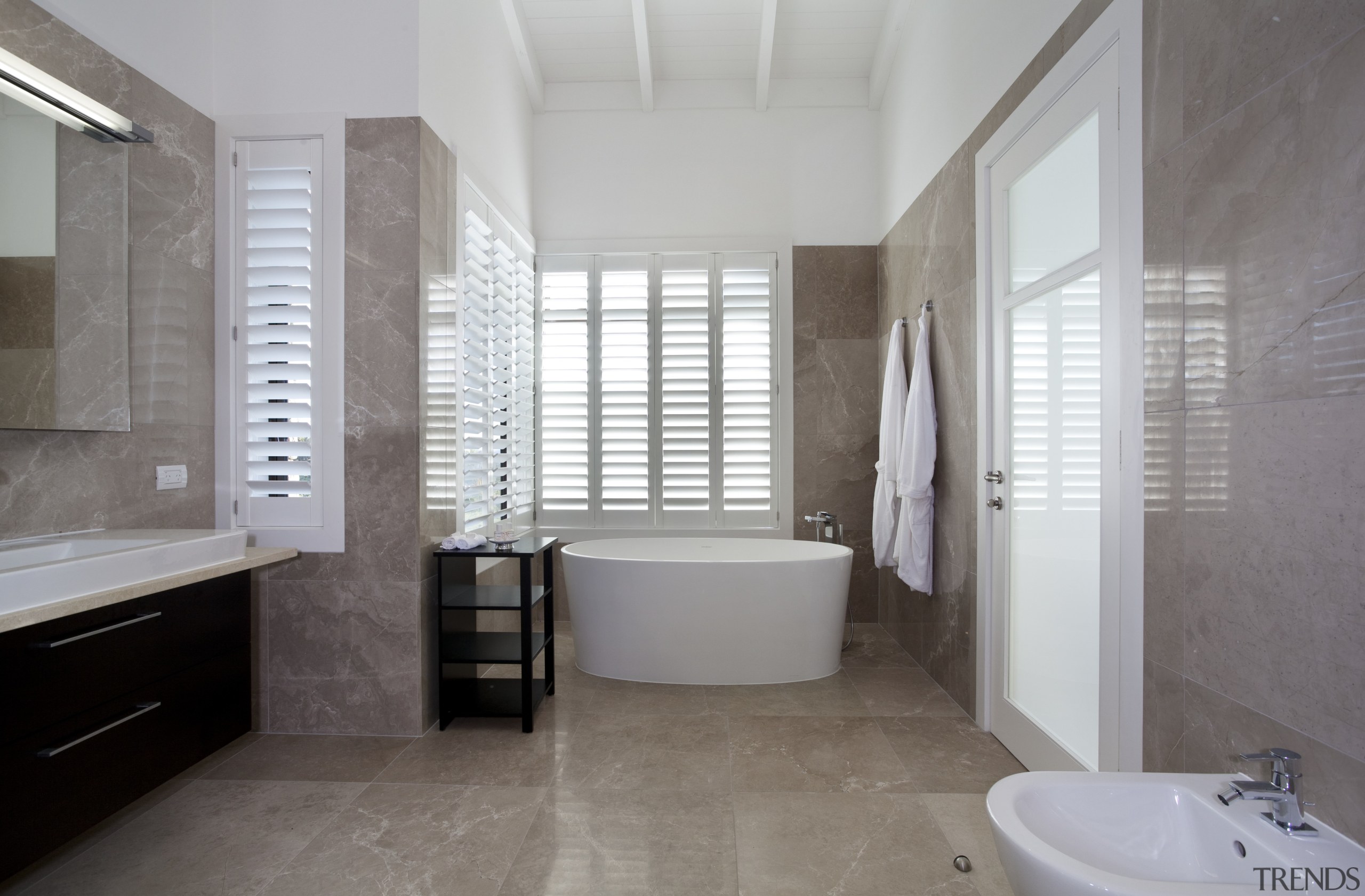 This home was designed by Peter Chibnall of architecture, bathroom, bathroom accessory, daylighting, estate, floor, flooring, home, interior design, property, real estate, room, tile, window, gray