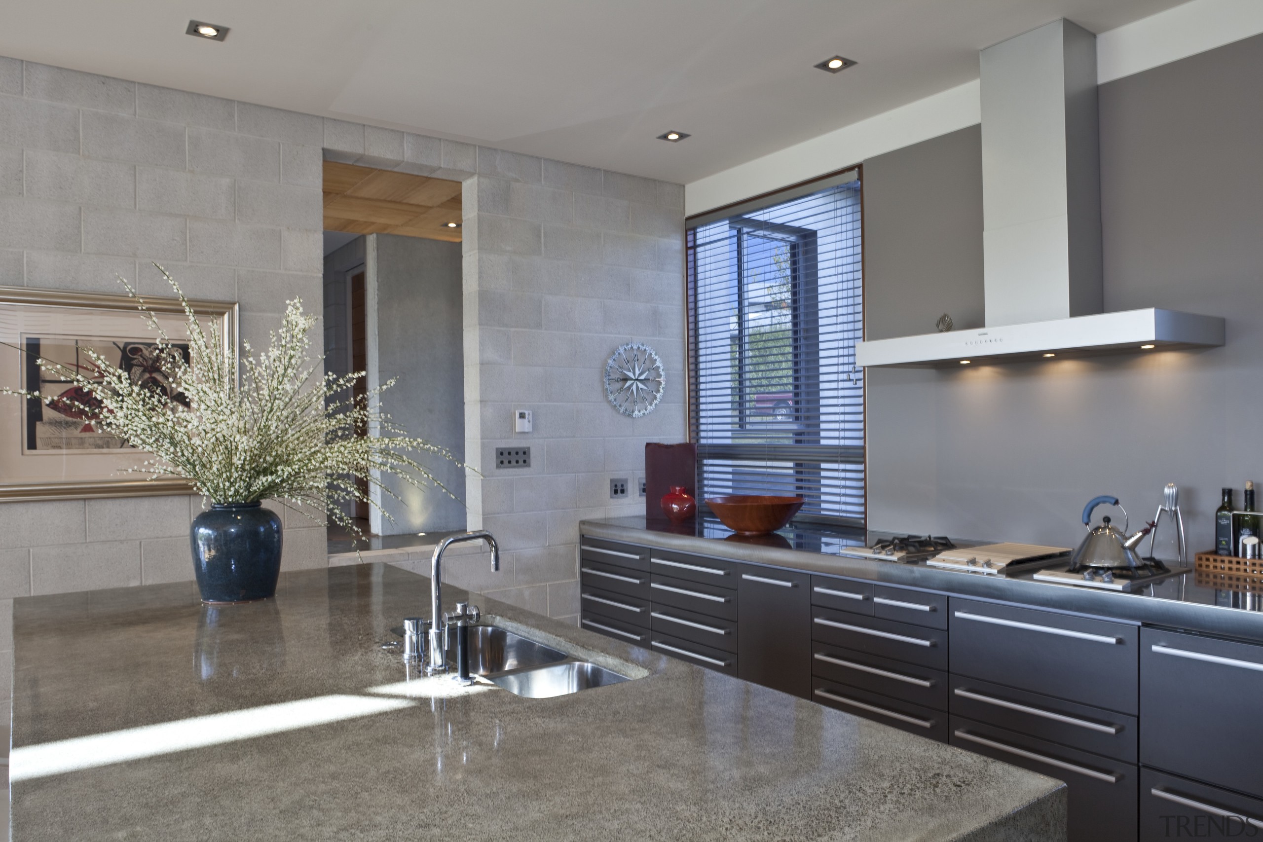 View of kitchen which features concrete benchtops, painted countertop, flooring, interior design, kitchen, real estate, room, window, gray