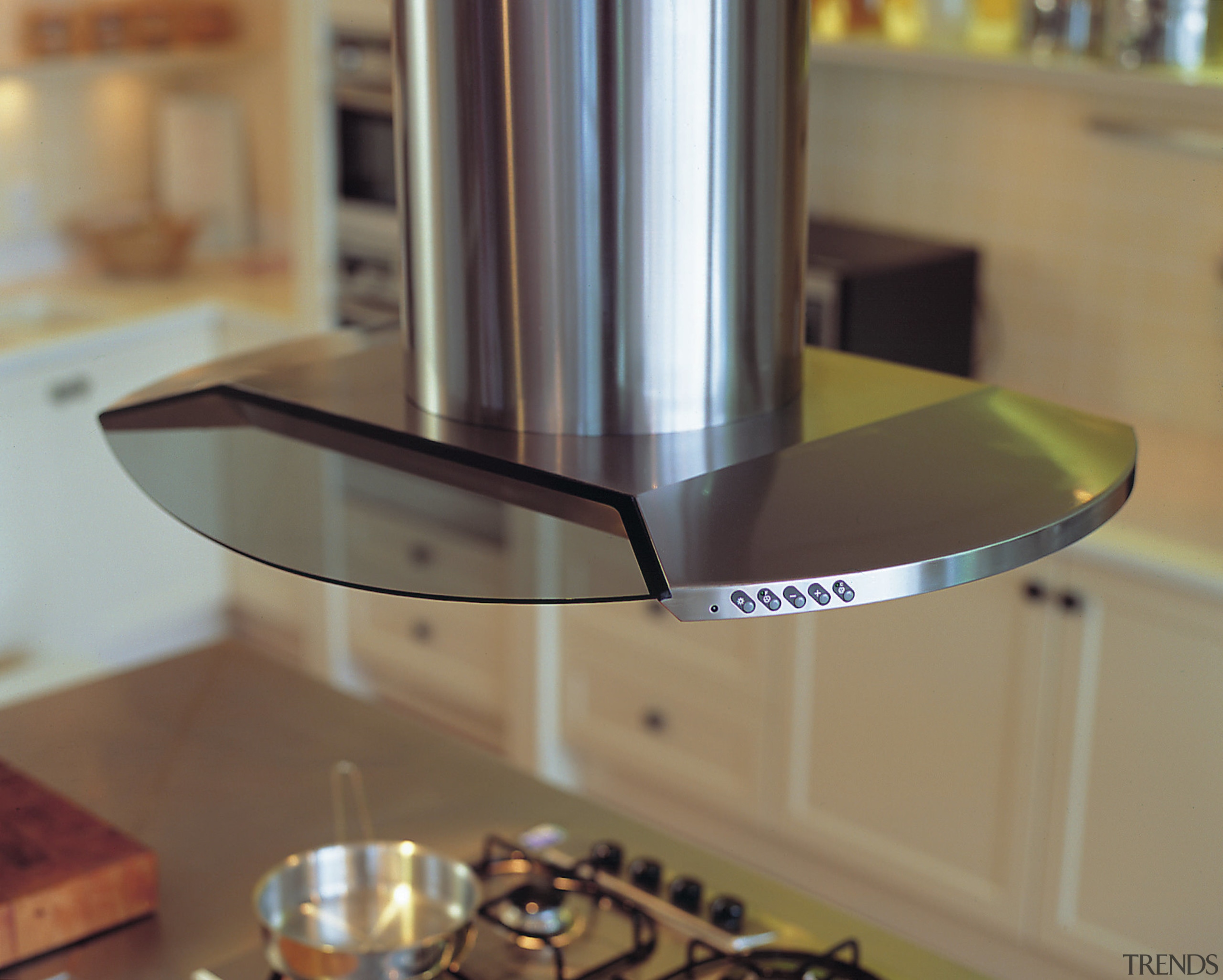 Stainless steel and glass canopy hood set over countertop, glass, brown