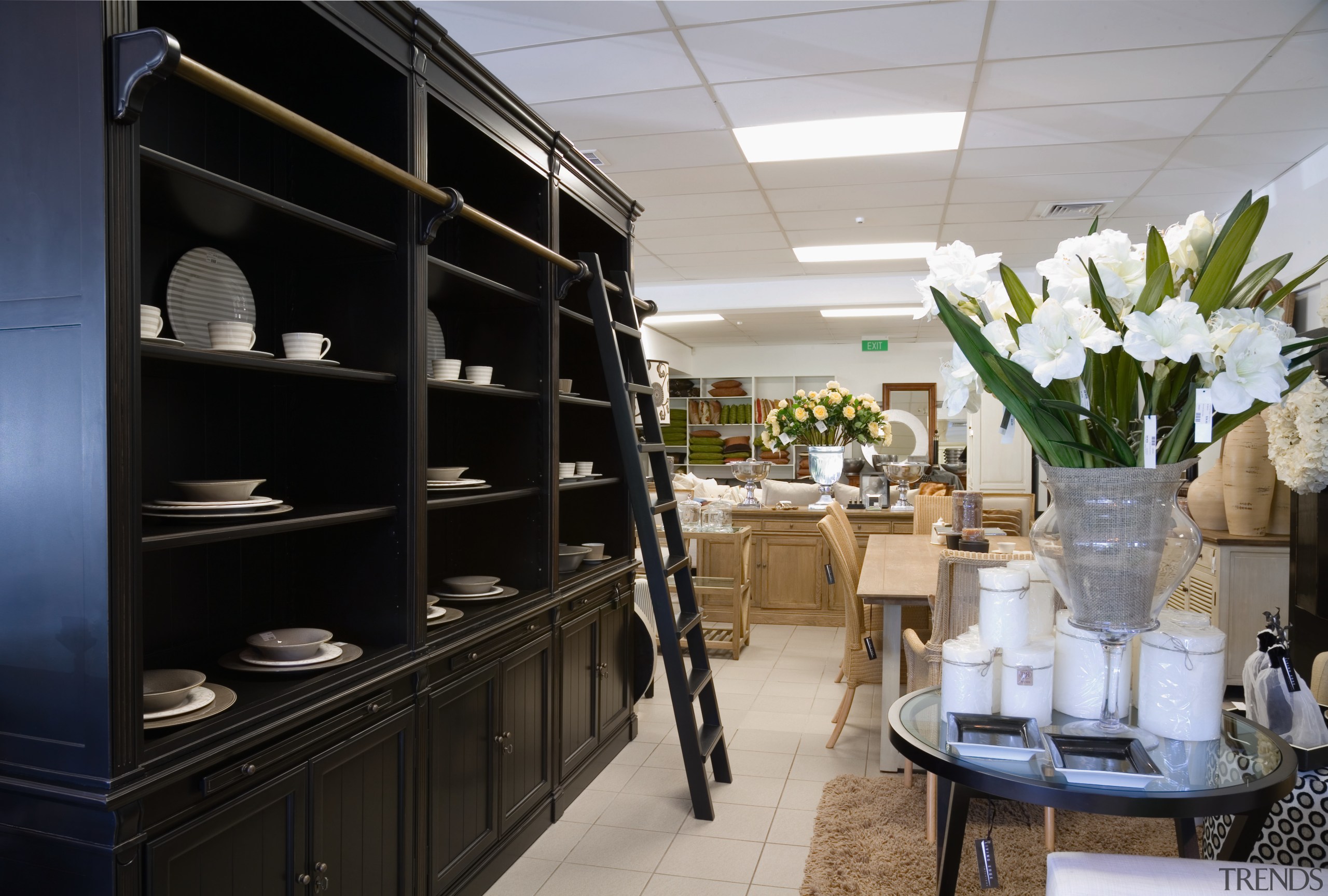 Showroom with mixture of furnishings and accessories, including furniture, interior design, black, gray