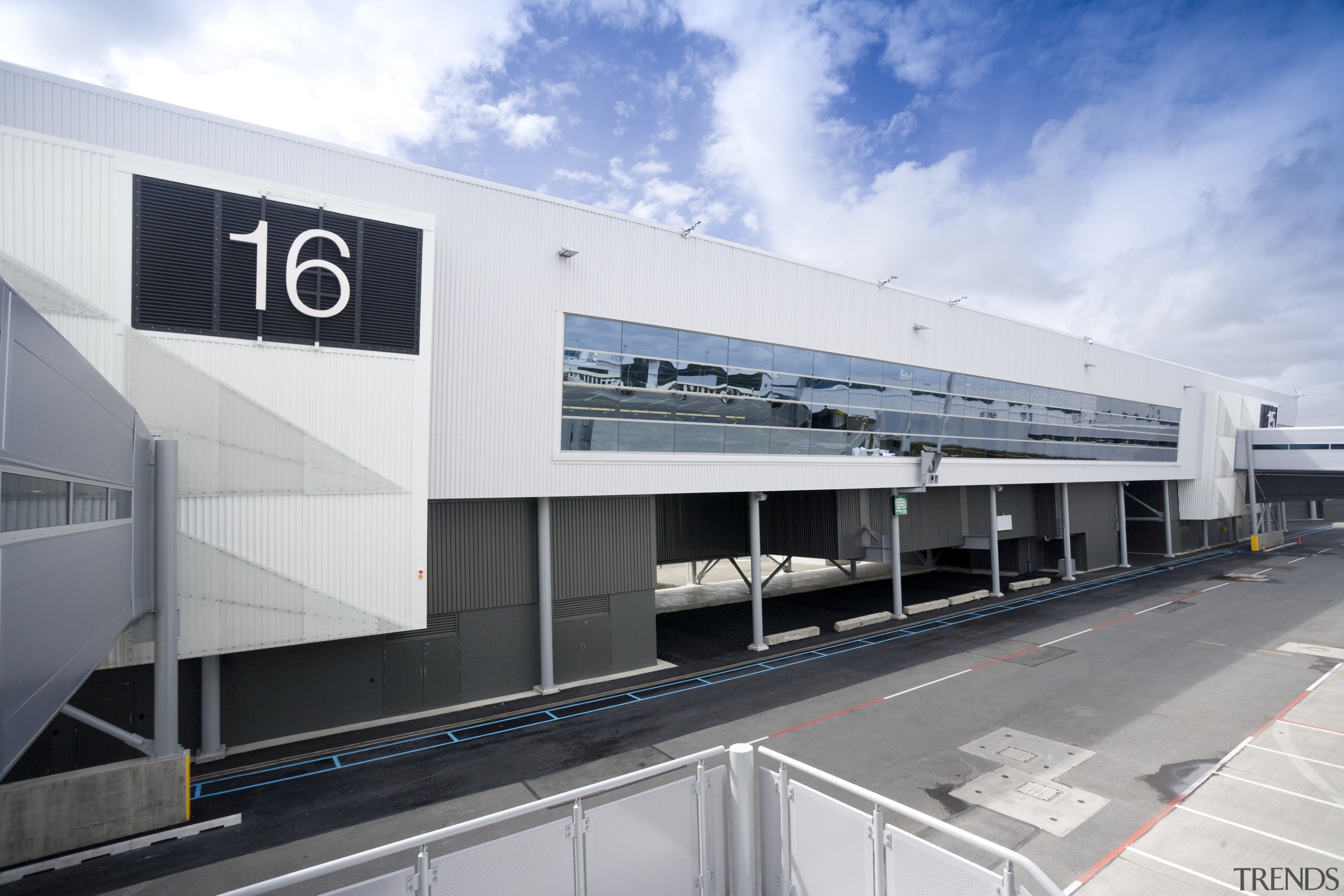 Images of the international terminal at Auckland Airport. airport terminal, architecture, building, corporate headquarters, facade, infrastructure, metropolitan area, public transport, sky, structure, transport, white