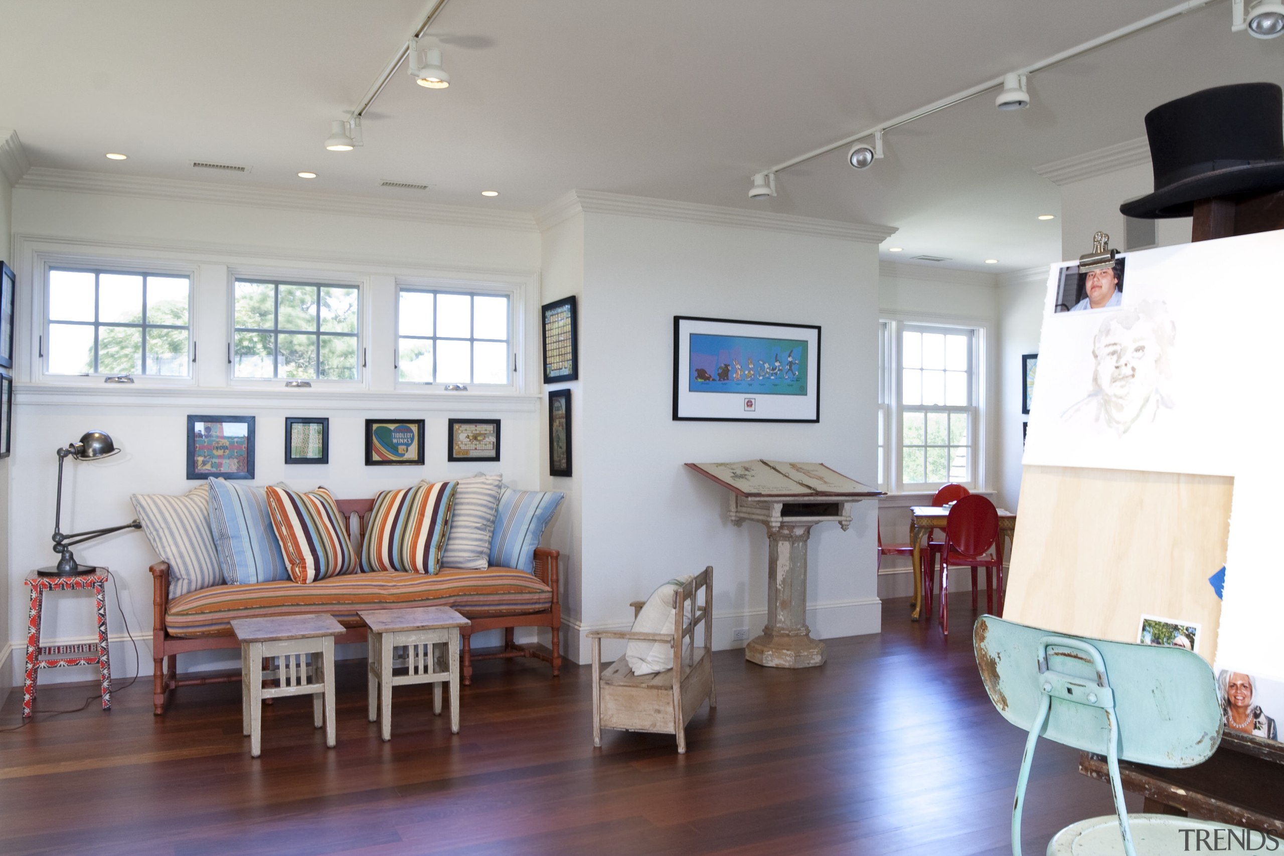 View of a home studio with wooden floors ceiling, floor, furniture, interior design, living room, real estate, room, table, gray, white