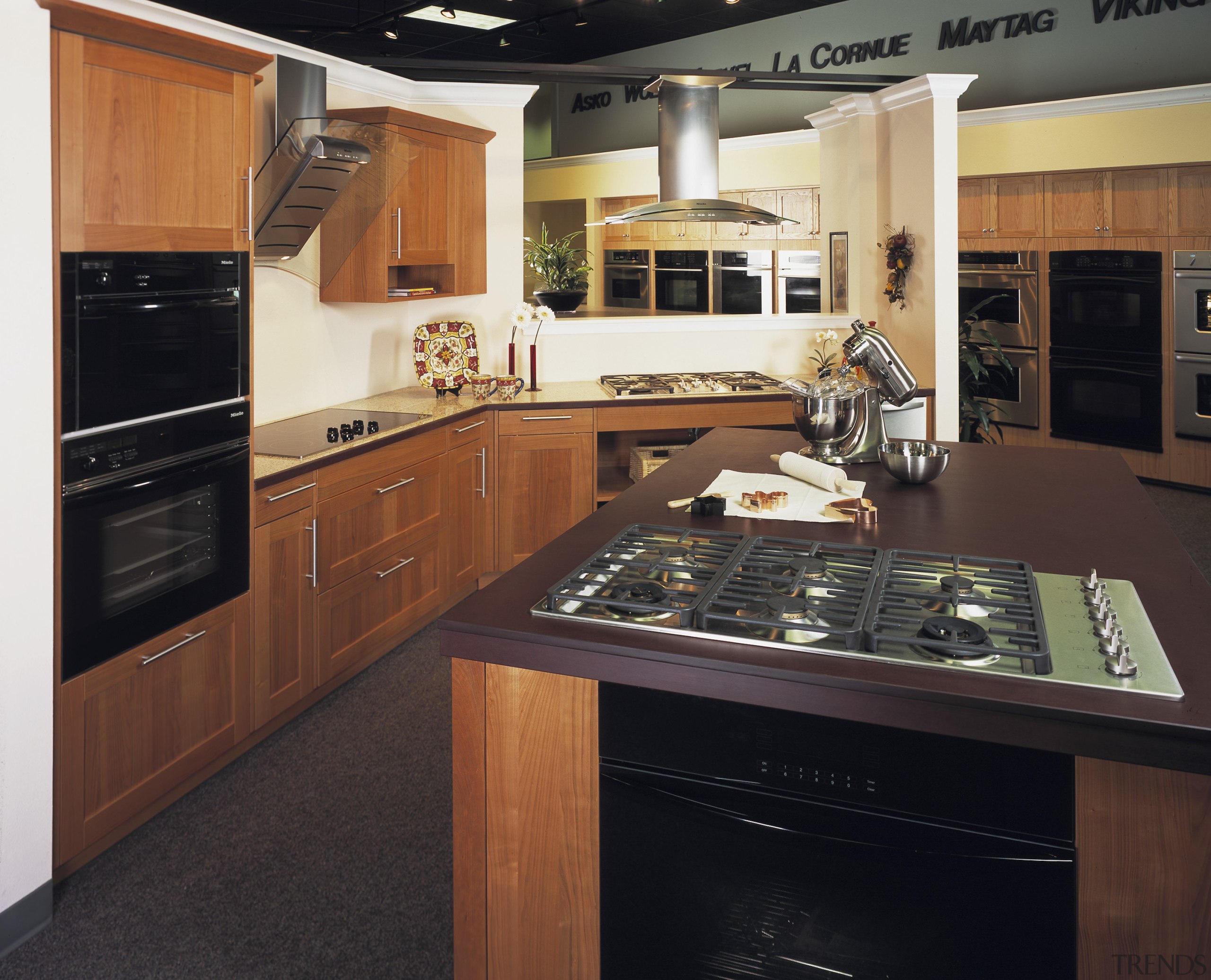 This kitchen setting, in Standard of Excellence's  cabinetry, countertop, cuisine classique, floor, flooring, hardwood, interior design, kitchen, room, wood flooring, black, brown
