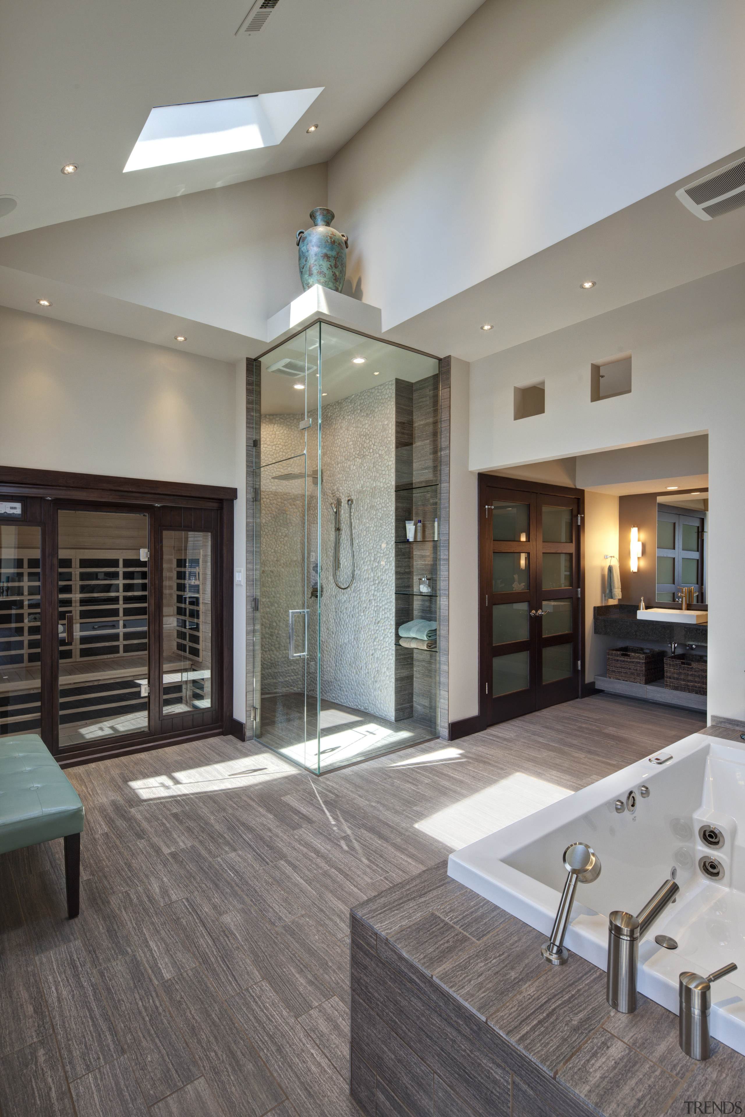 Large vanity mirrors reflect the view. The vanity ceiling, floor, flooring, interior design, living room, lobby, real estate, gray