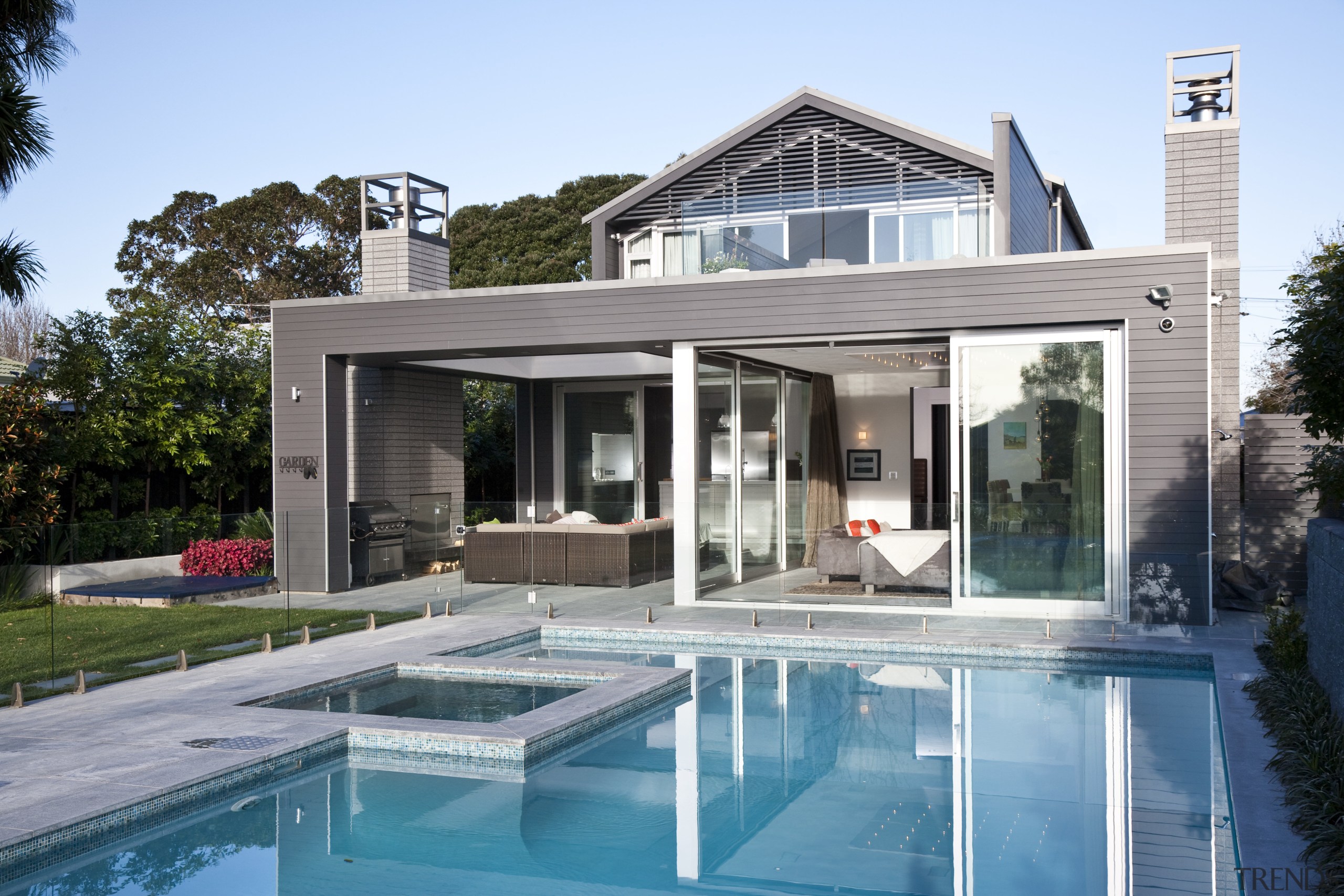 Exterior view of this modern home by Jessop architecture, backyard, estate, home, house, property, real estate, swimming pool, villa, window, teal