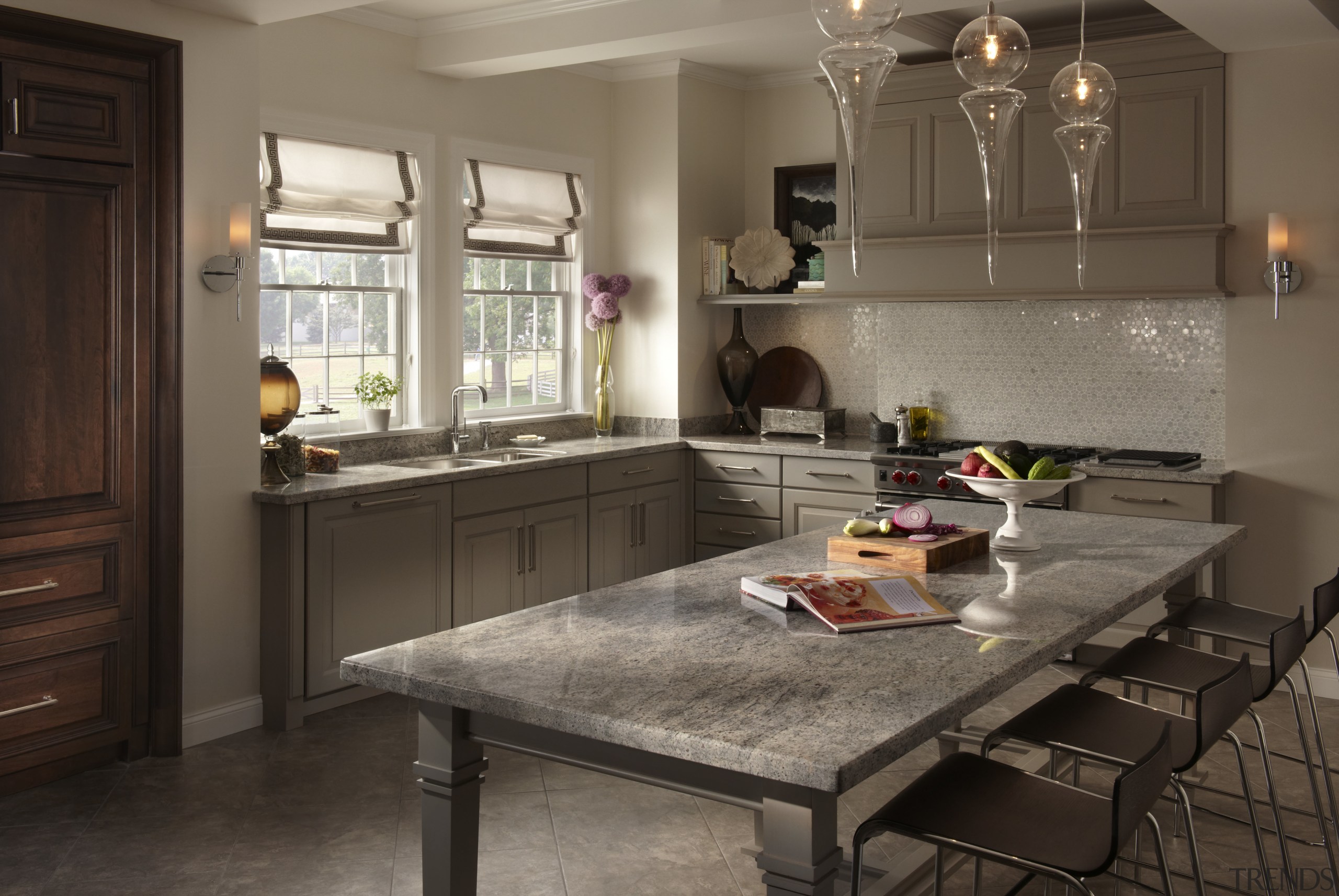 View of a contemporary kitchen which features countertops cabinetry, countertop, cuisine classique, flooring, interior design, kitchen, room, black, brown, gray
