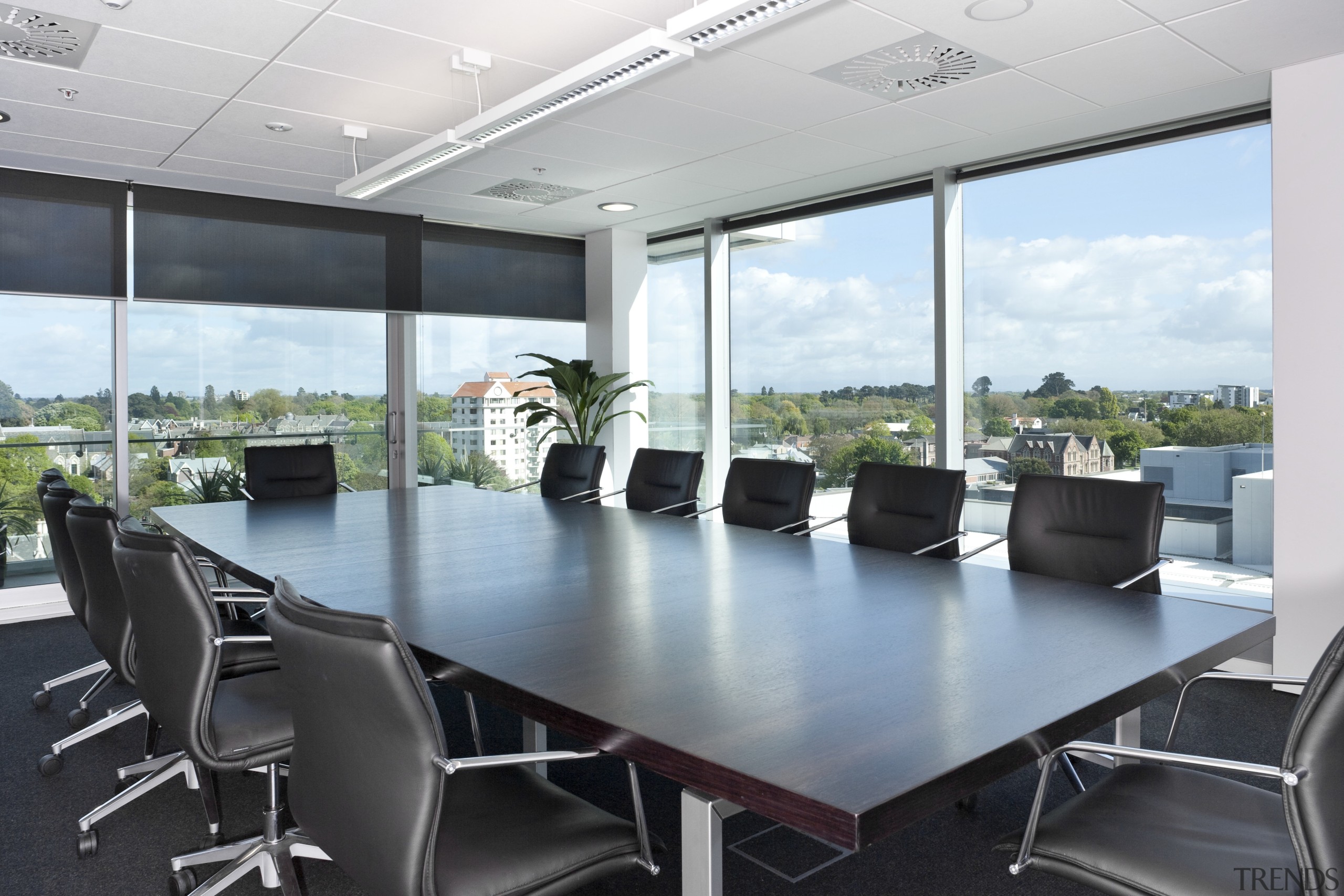 The office interiors at the Club Tower reflect conference hall, interior design, office, real estate, table, white, black, gray