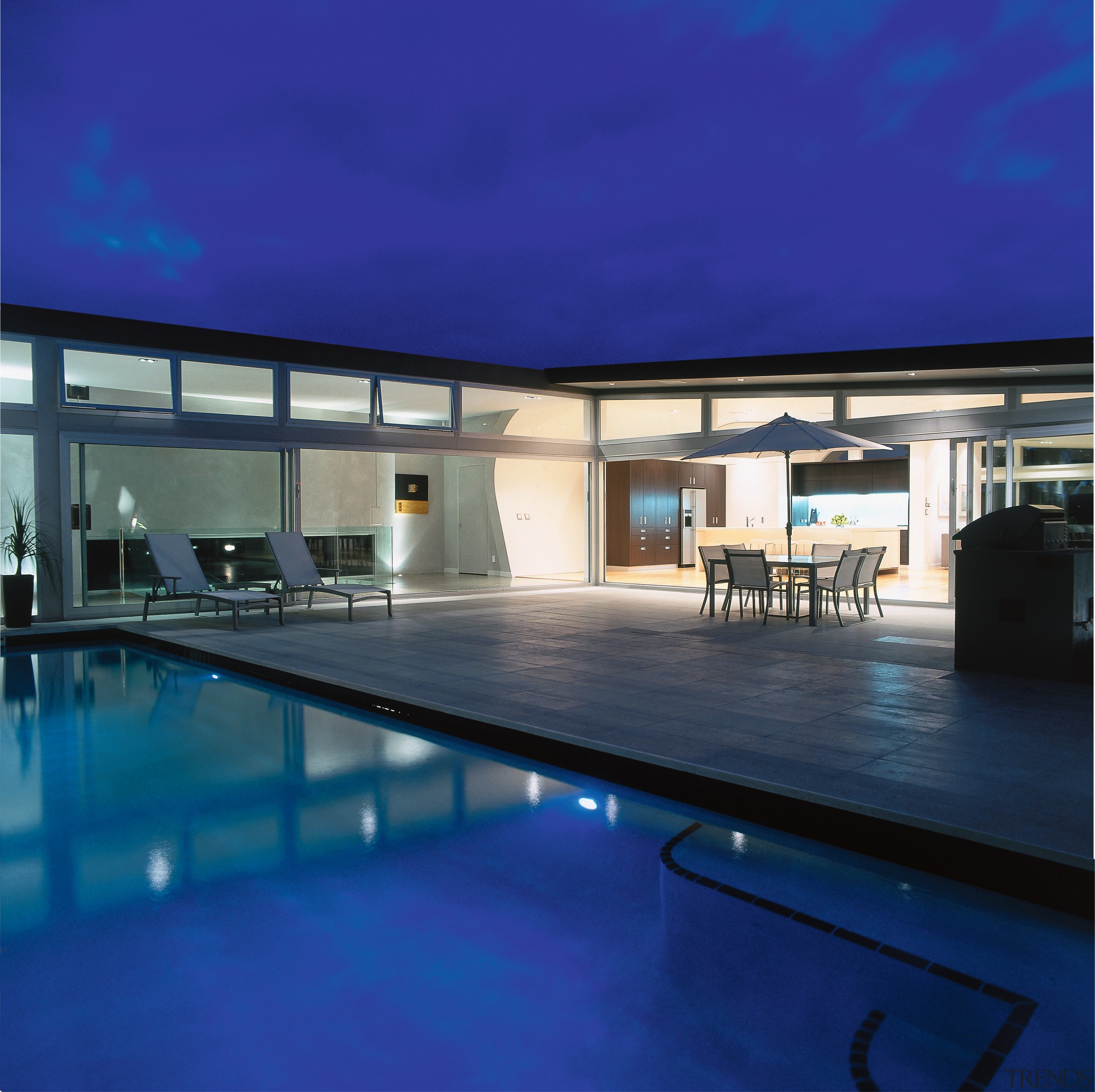 A viewof the pool and patio area. - architecture, condominium, daylighting, estate, house, leisure centre, lighting, property, real estate, sky, swimming pool, blue