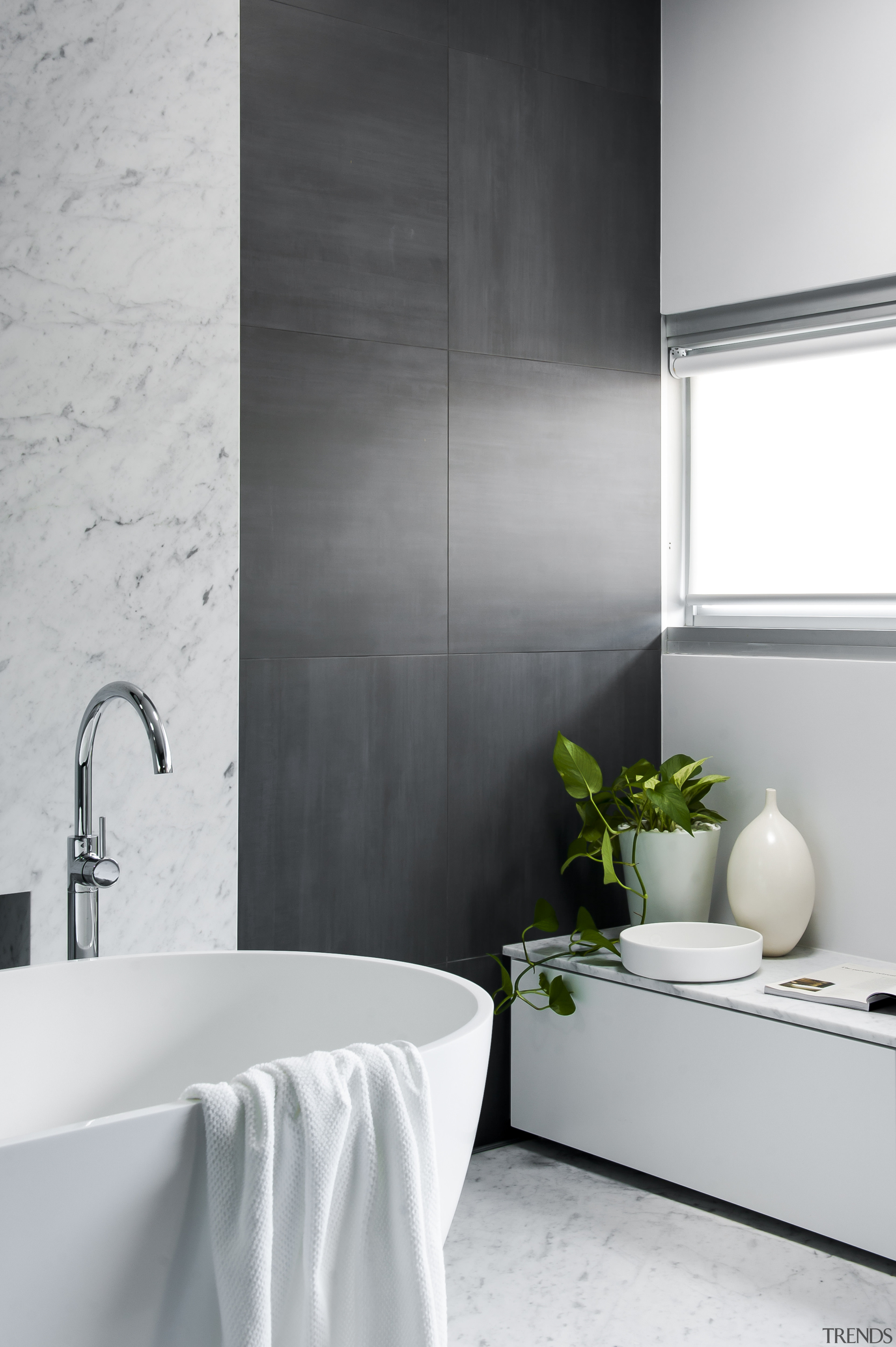 Floating the laundry hamper-cum-seating area along with the bathroom, black and white, ceramic, floor, flooring, home, interior design, plumbing fixture, product design, room, tap, tile, wall, gray