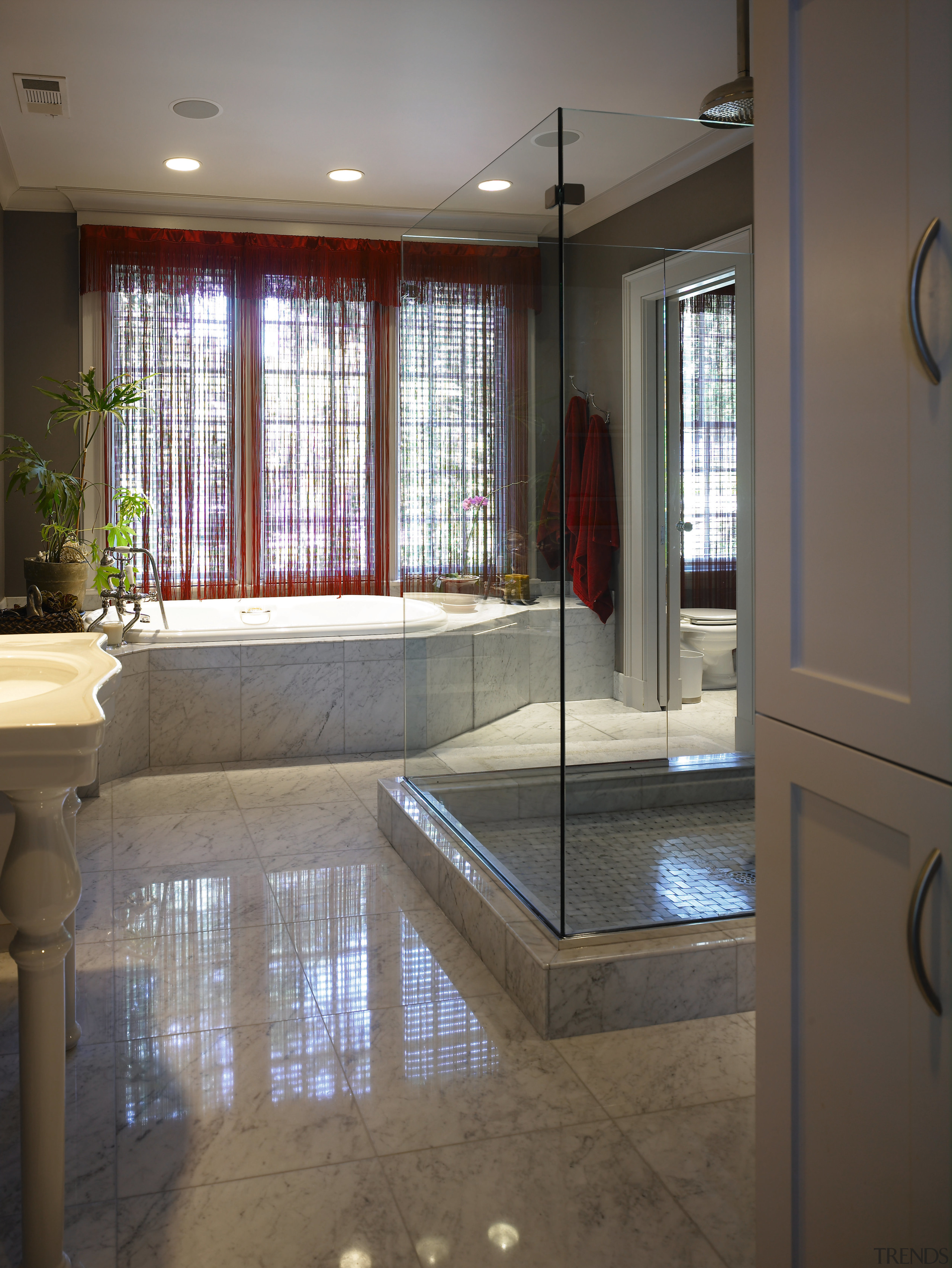 The master bathroom demonstartes an amalgamation of contempoary estate, floor, flooring, interior design, real estate, room, tile, window, gray