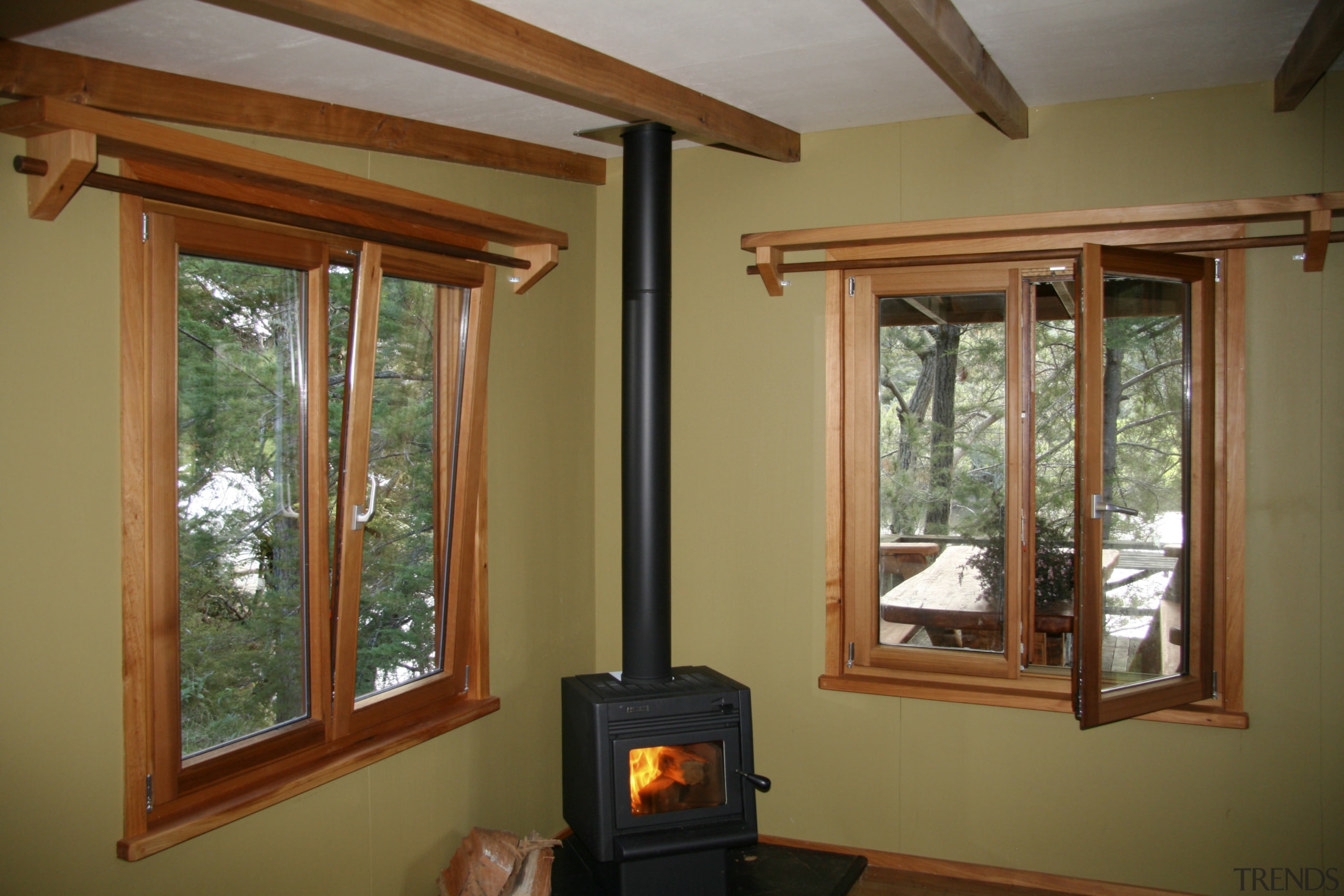 View of windows with wooden frames from Heirloom home, house, interior design, living room, real estate, window, wood stain, brown