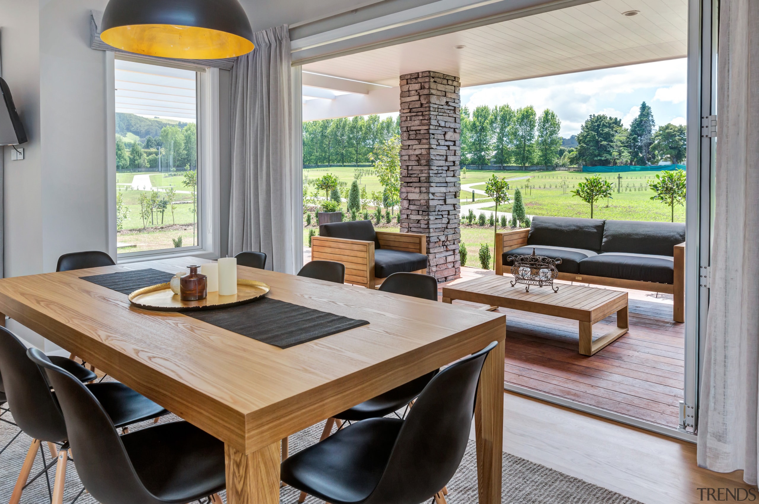 The covered outdoor room in Landmark Homes Karapiro dining room, interior design, living room, real estate, table, window, gray