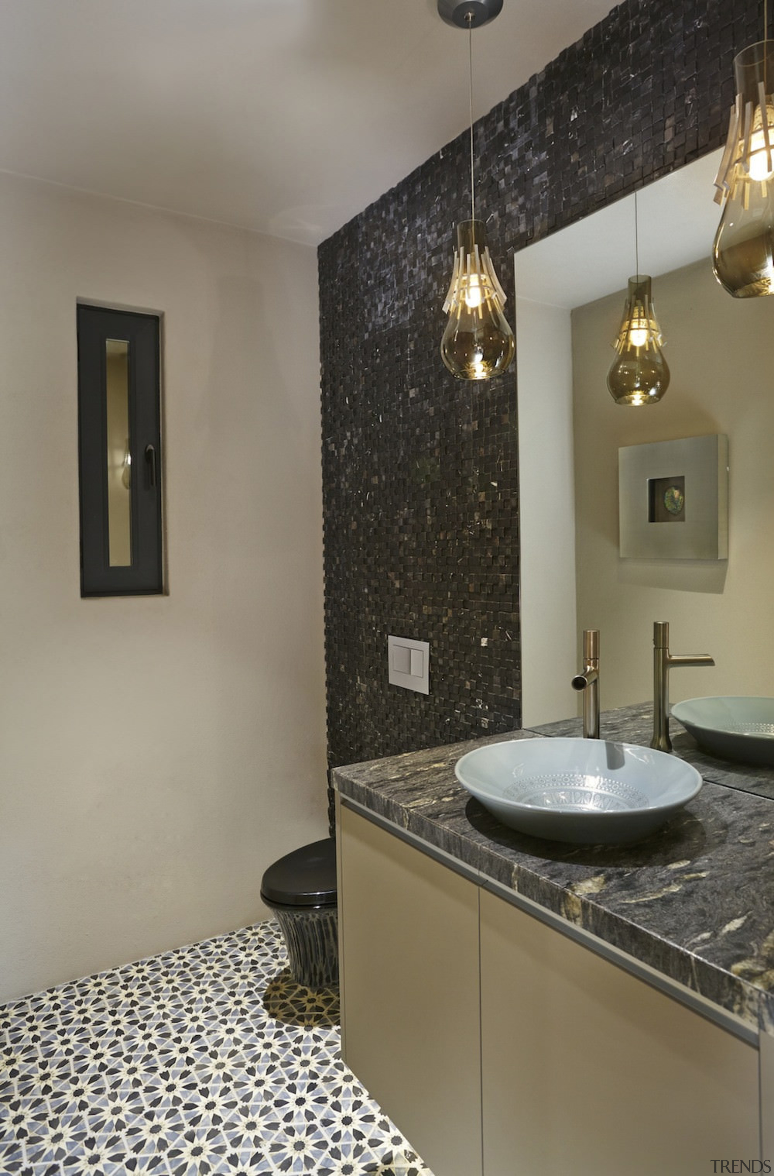 There are black and gold touches throughout the bathroom, countertop, floor, flooring, home, interior design, real estate, room, sink, tile, gray