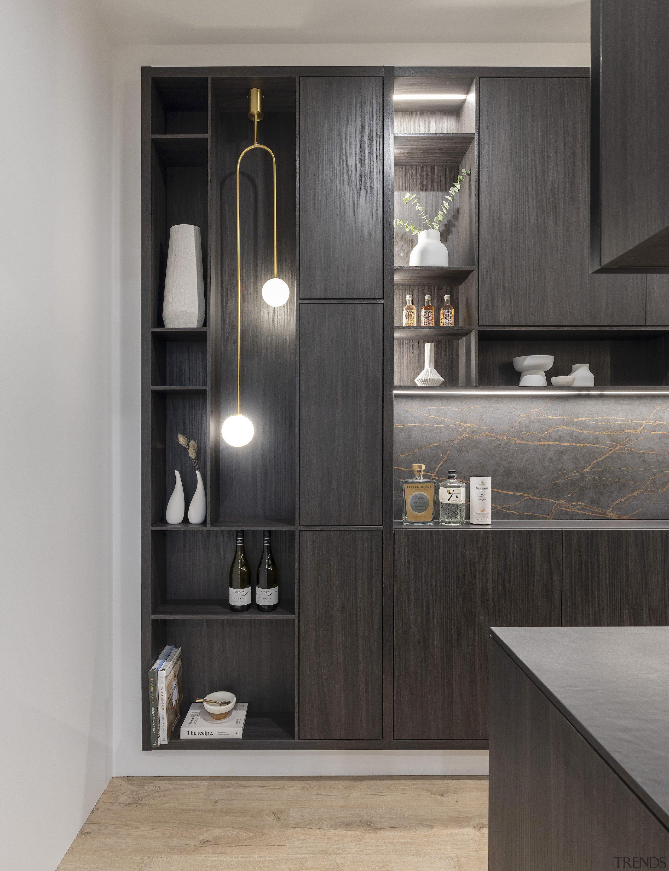 A brass pendant shows off the scullery cabinetry 