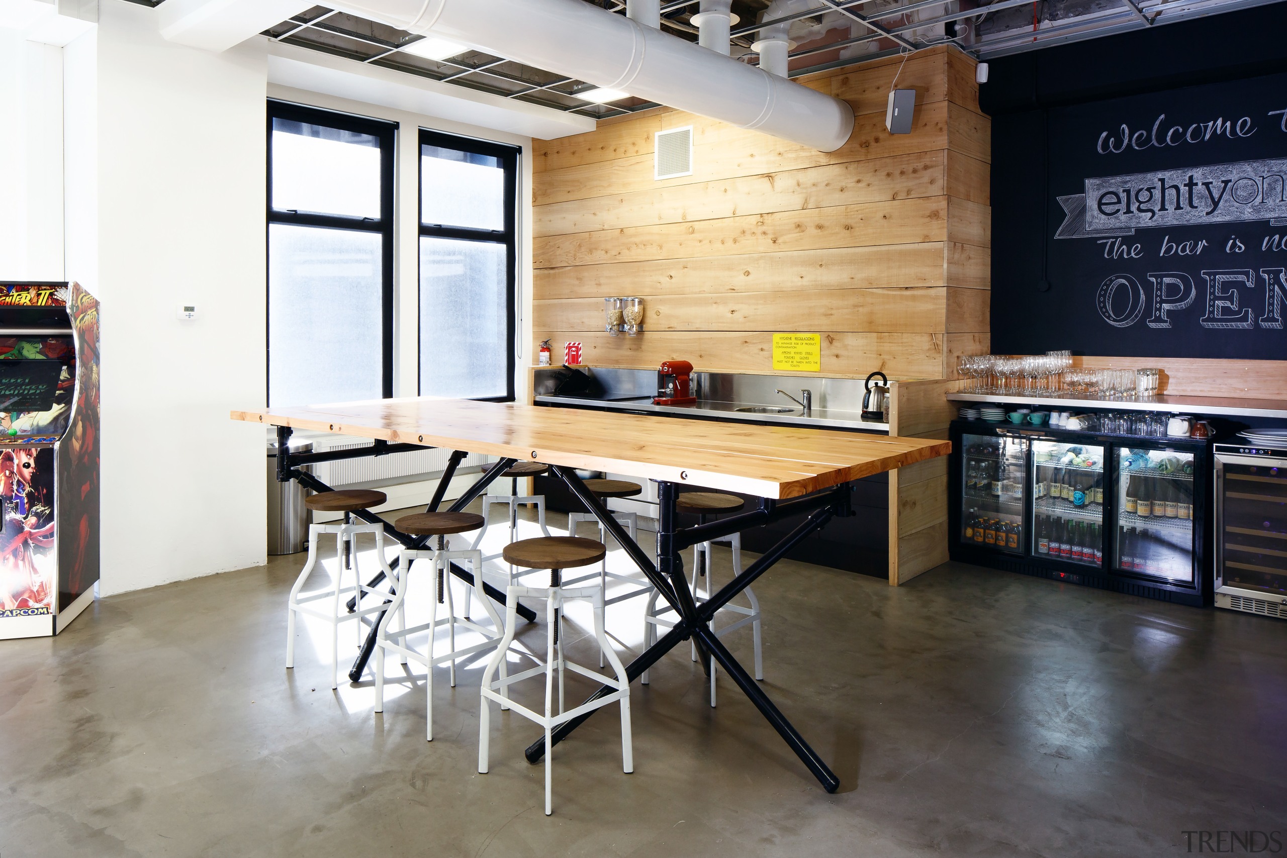 The wood and stainless steel kitchen and adjacent countertop, flooring, furniture, interior design, kitchen, loft, table, white, black