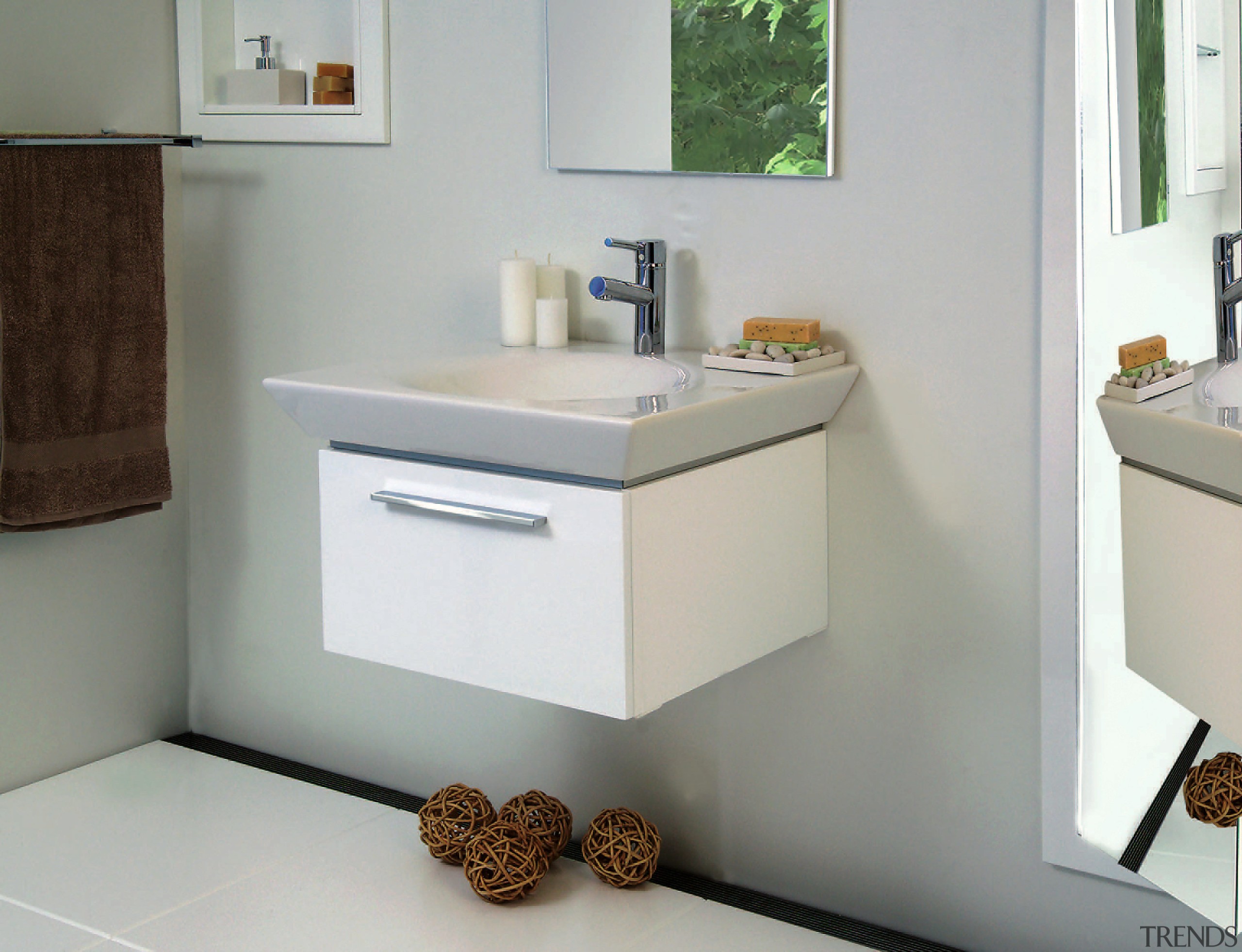 A view of a white vanity and sink, bathroom, bathroom accessory, bathroom cabinet, bathroom sink, drawer, furniture, plumbing fixture, product, product design, sink, tap, gray