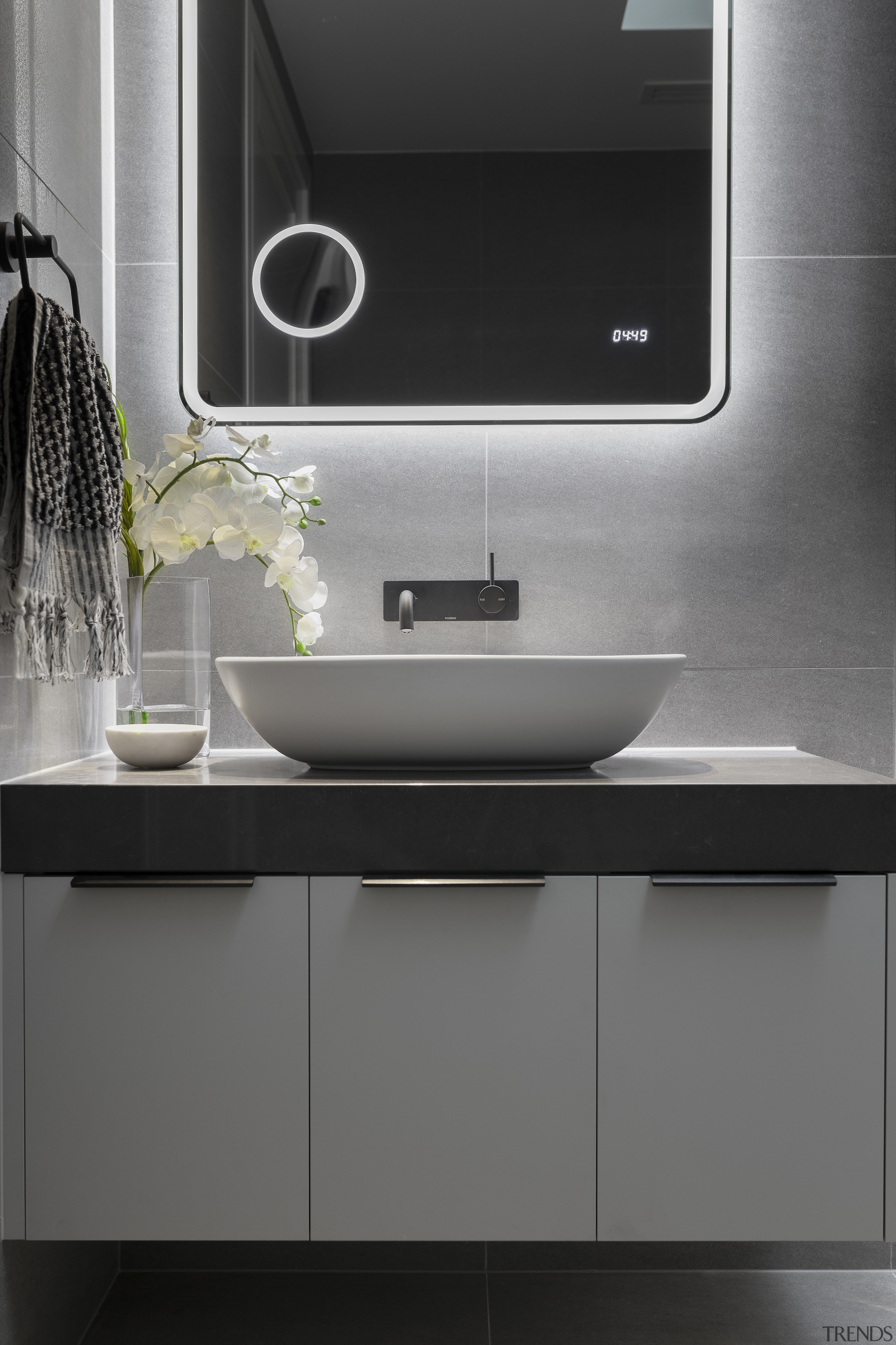 Cantilevering the vanity adds to the bathroom's sense 