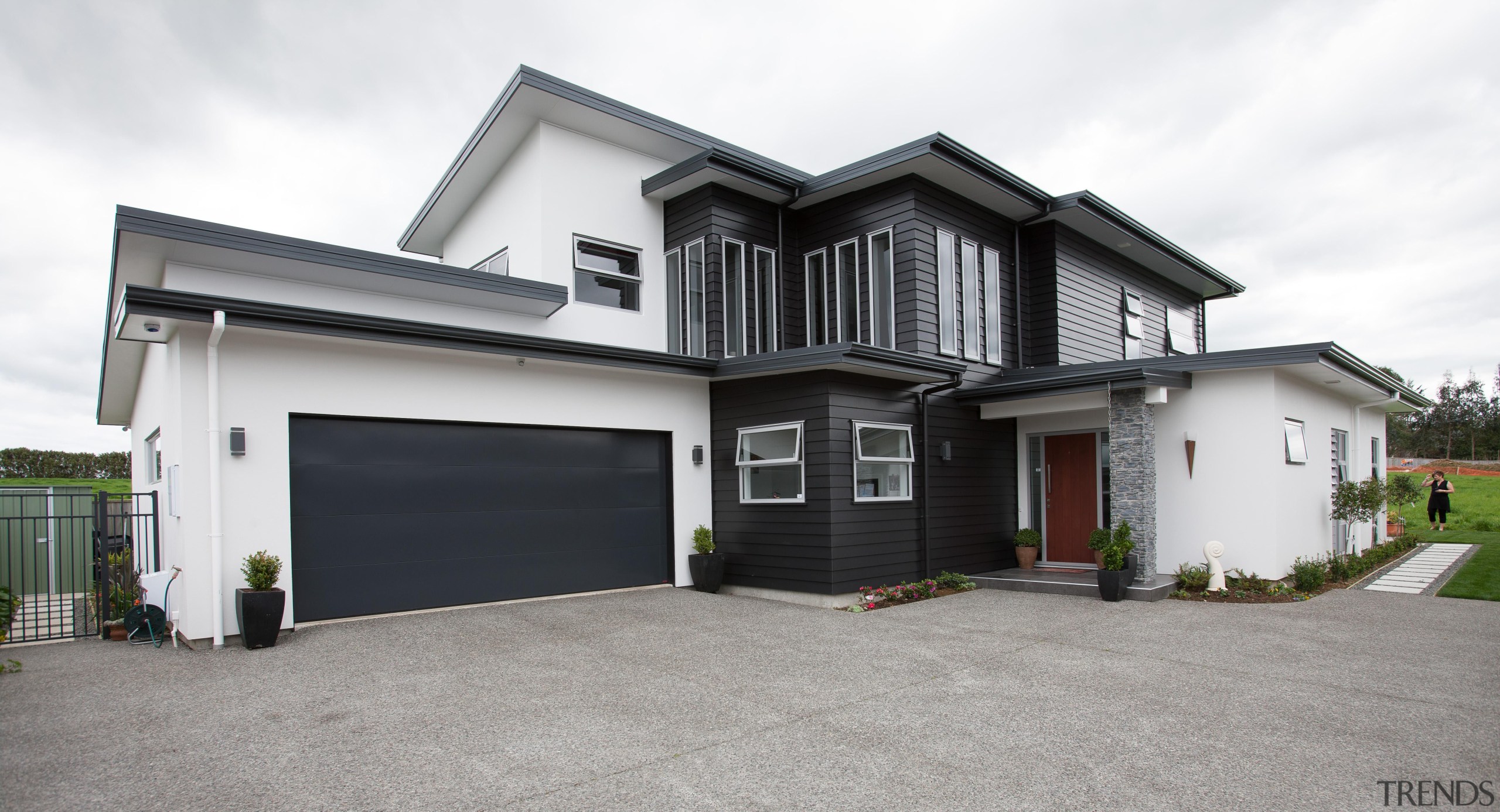 With easy access leading to this stunning customer building, elevation, estate, facade, home, house, property, real estate, residential area, siding, window, white, gray