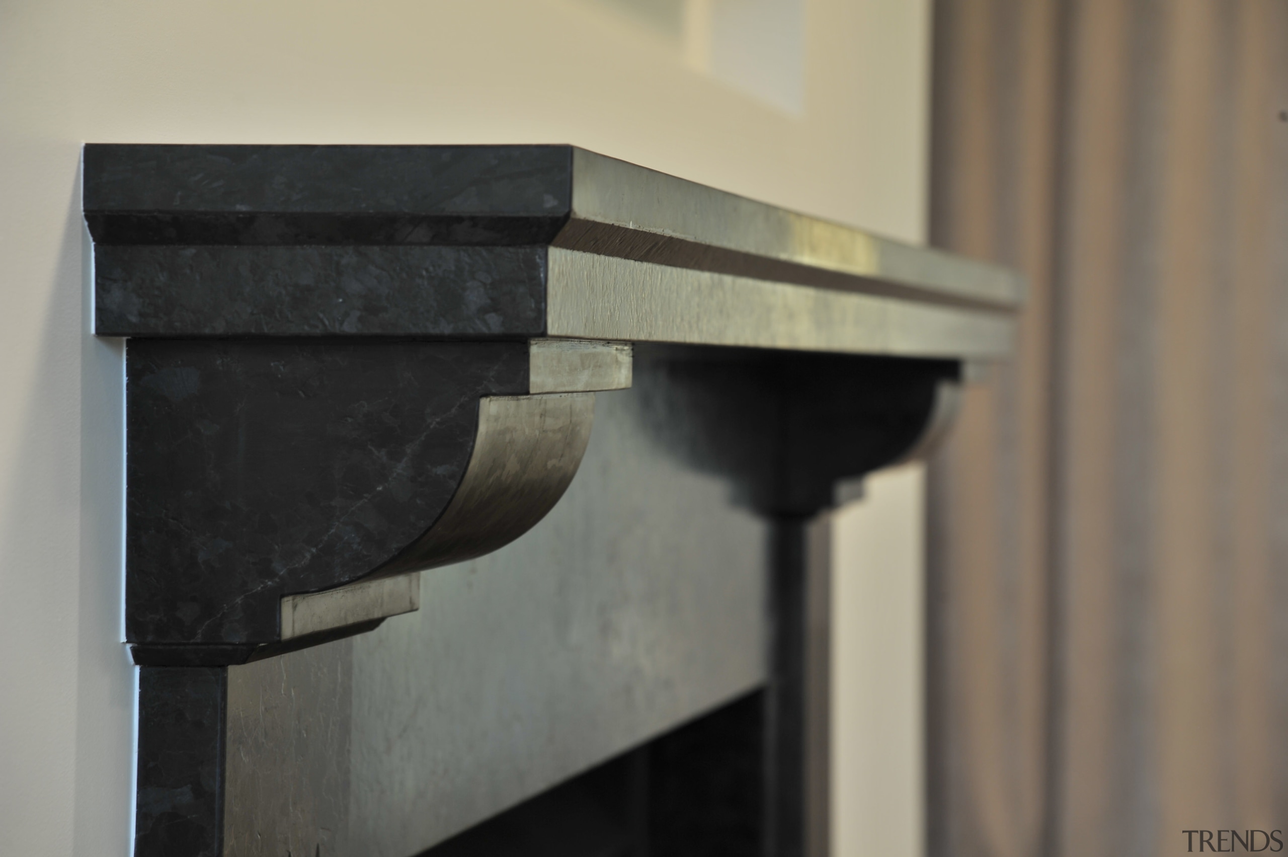 Granite fireplace surround by Granite Pacifica - Granite furniture, product design, wood, gray, black