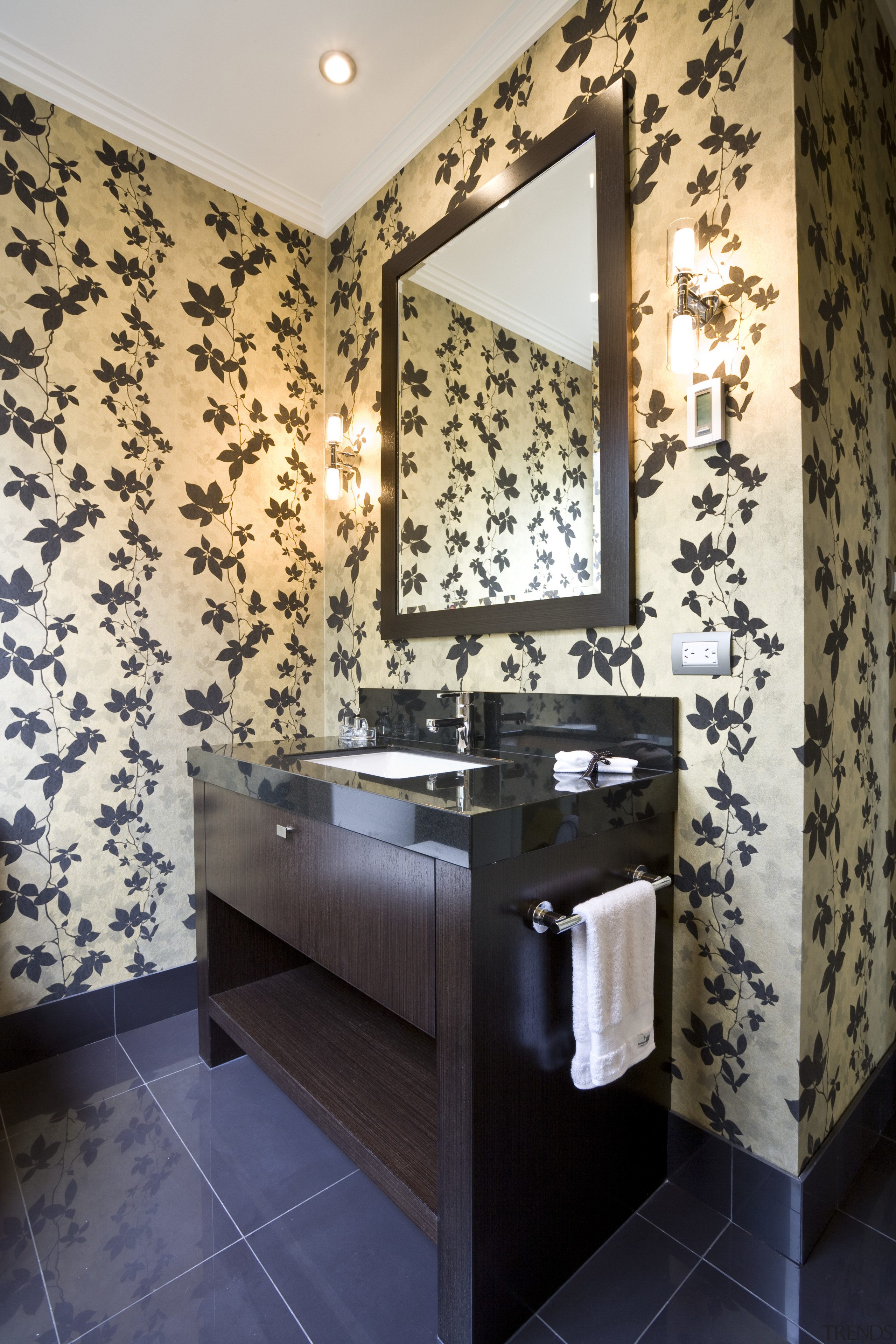 View of a bathroom designed by a Yellow bathroom, ceiling, floor, flooring, home, interior design, room, tile, wall, black