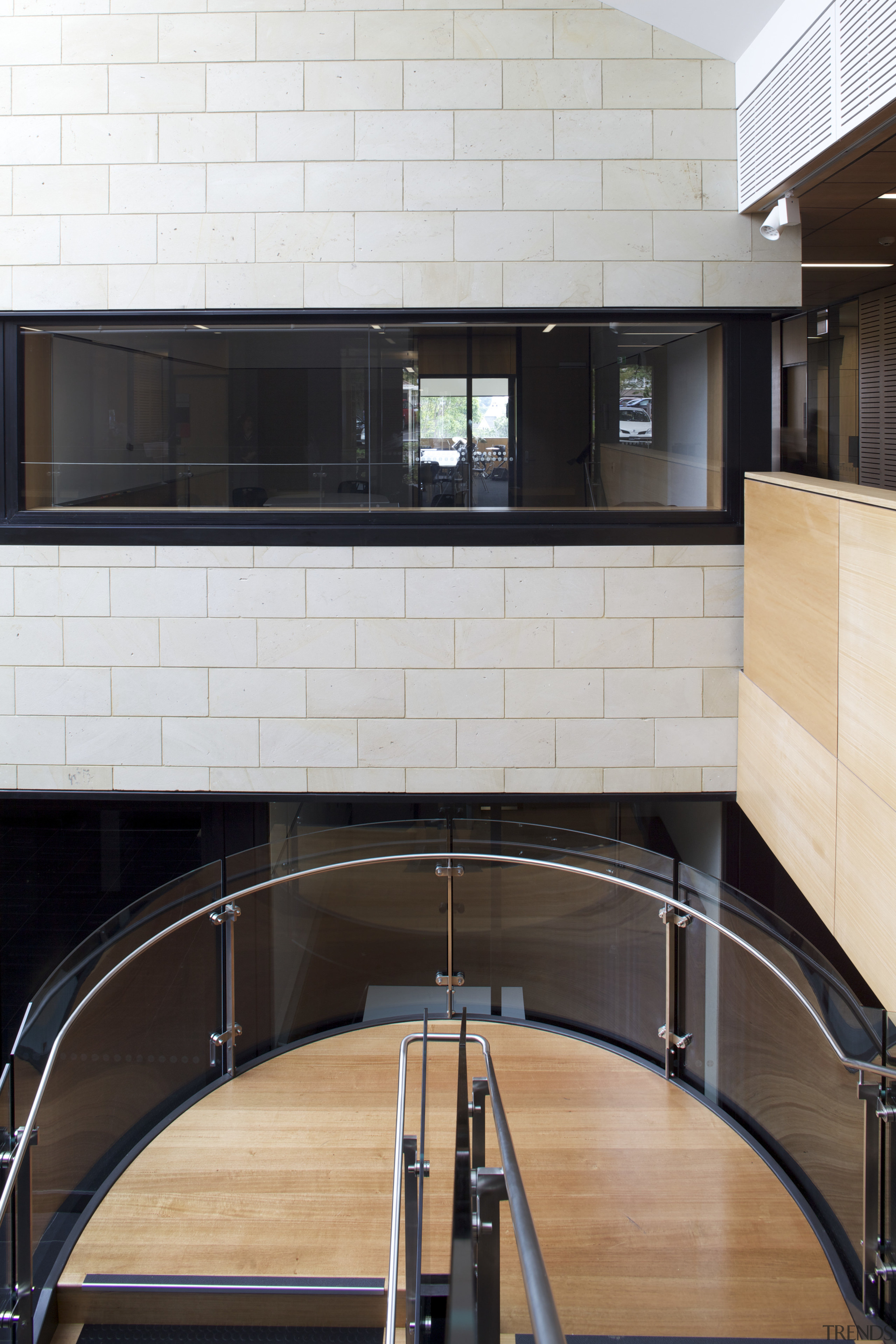 Interior with wooden stairs and light toned stone apartment, architecture, countertop, daylighting, floor, flooring, glass, handrail, interior design, stairs, wall, white, black