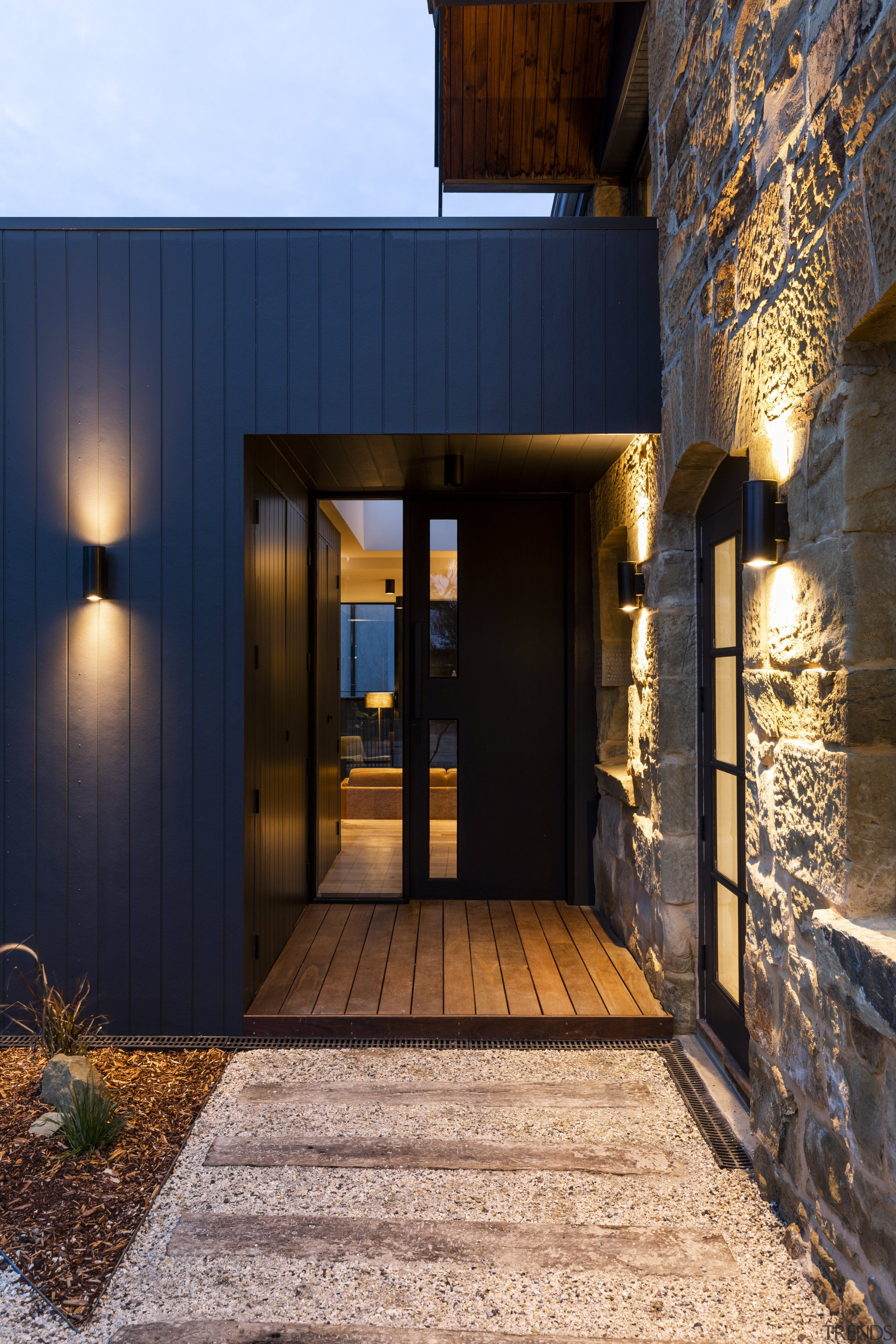 ​​​​​​​Exterior lighting accentuates the rough alongside the smooth black