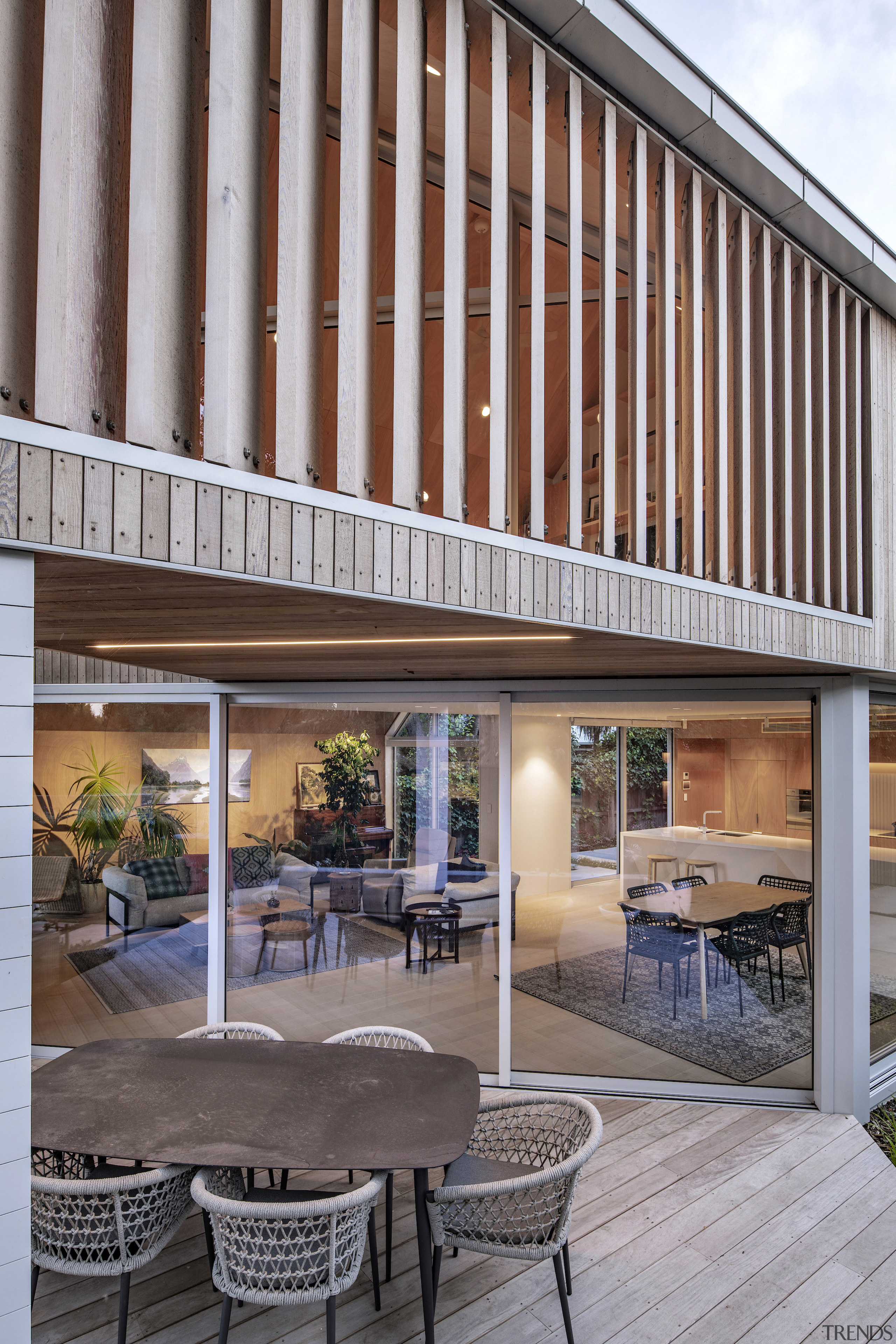 Large sliding doors are partly sheltered by the 