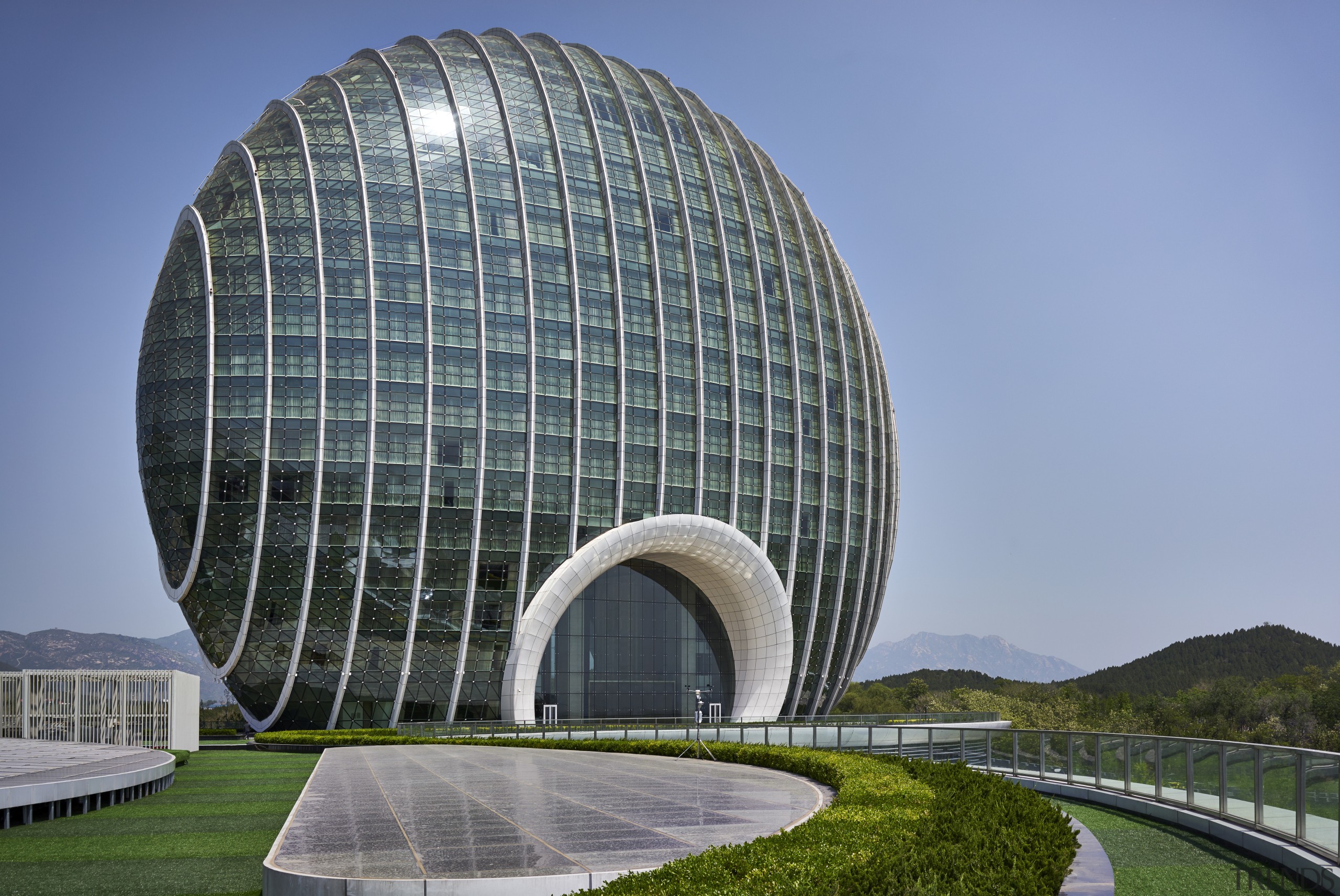 Tthe Sunrise Hotel Kempinski, Beijng, evokes the sun architecture, biome, building, corporate headquarters, daytime, dome, headquarters, landmark, sky, teal