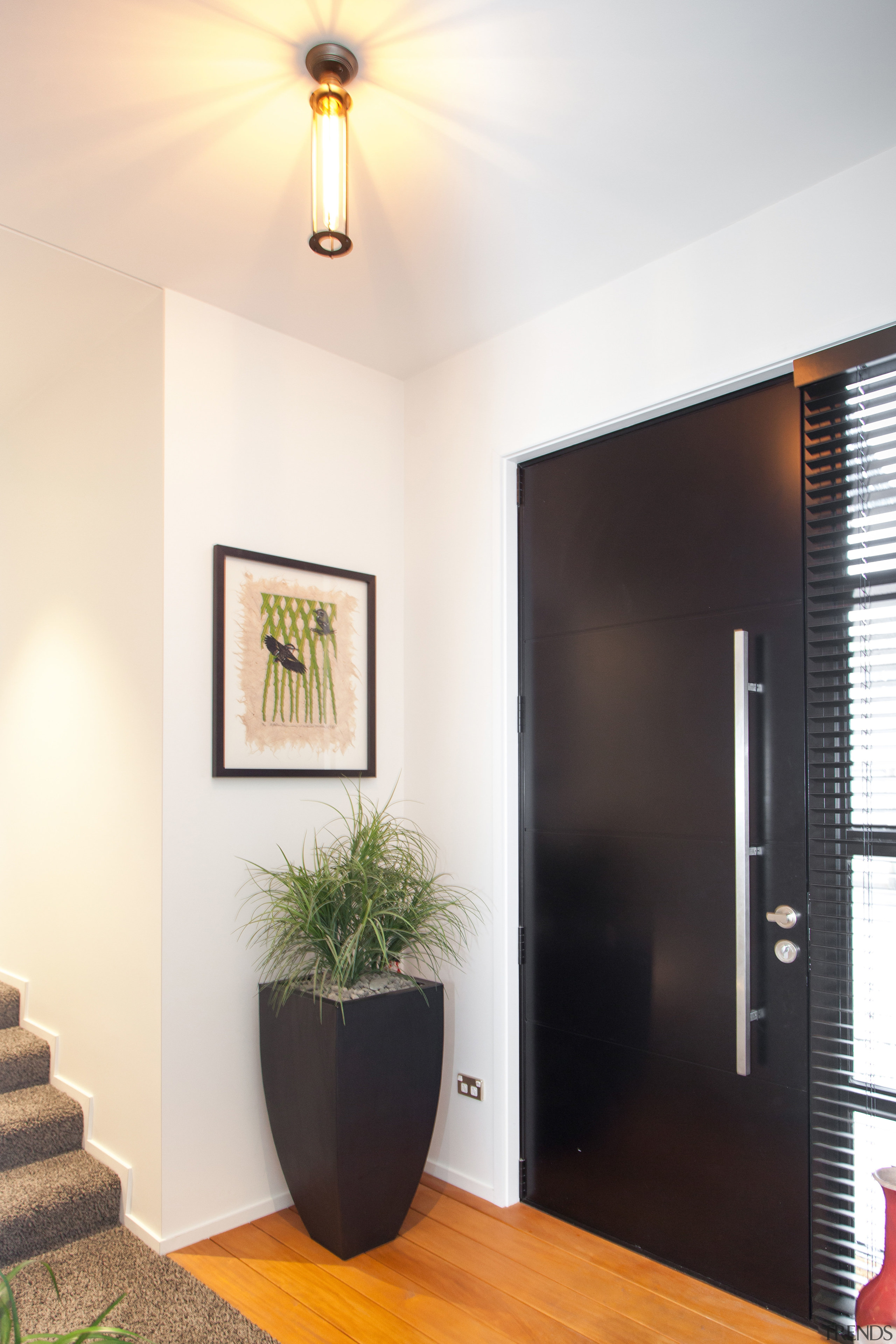 This entry opens directly into the hallway that ceiling, door, home, house, interior design, light fixture, lighting, wall, white