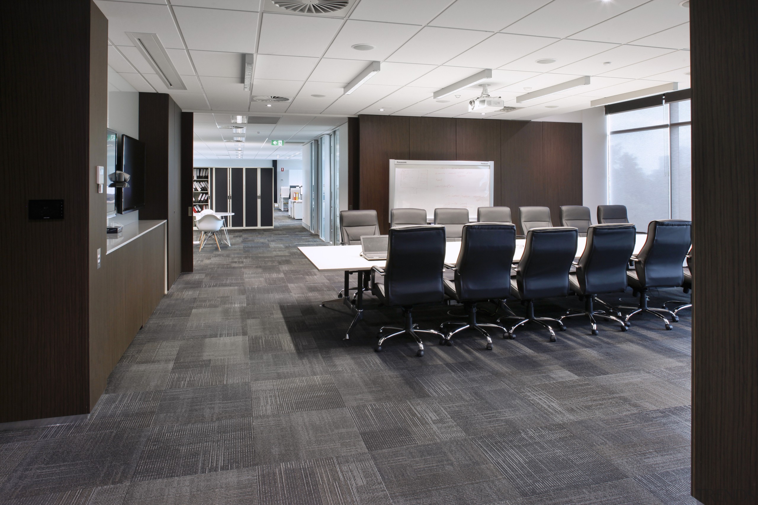 This boutique office development on a brownfields site conference hall, floor, flooring, interior design, lobby, office, tile, wood flooring, gray, black