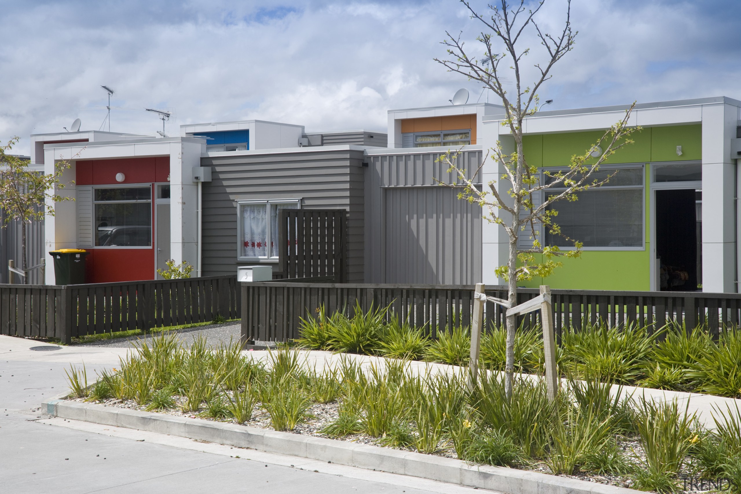 This Housing New Zealand Devlopment features modular homes, architecture, building, elevation, facade, home, house, neighbourhood, property, real estate, residential area, gray