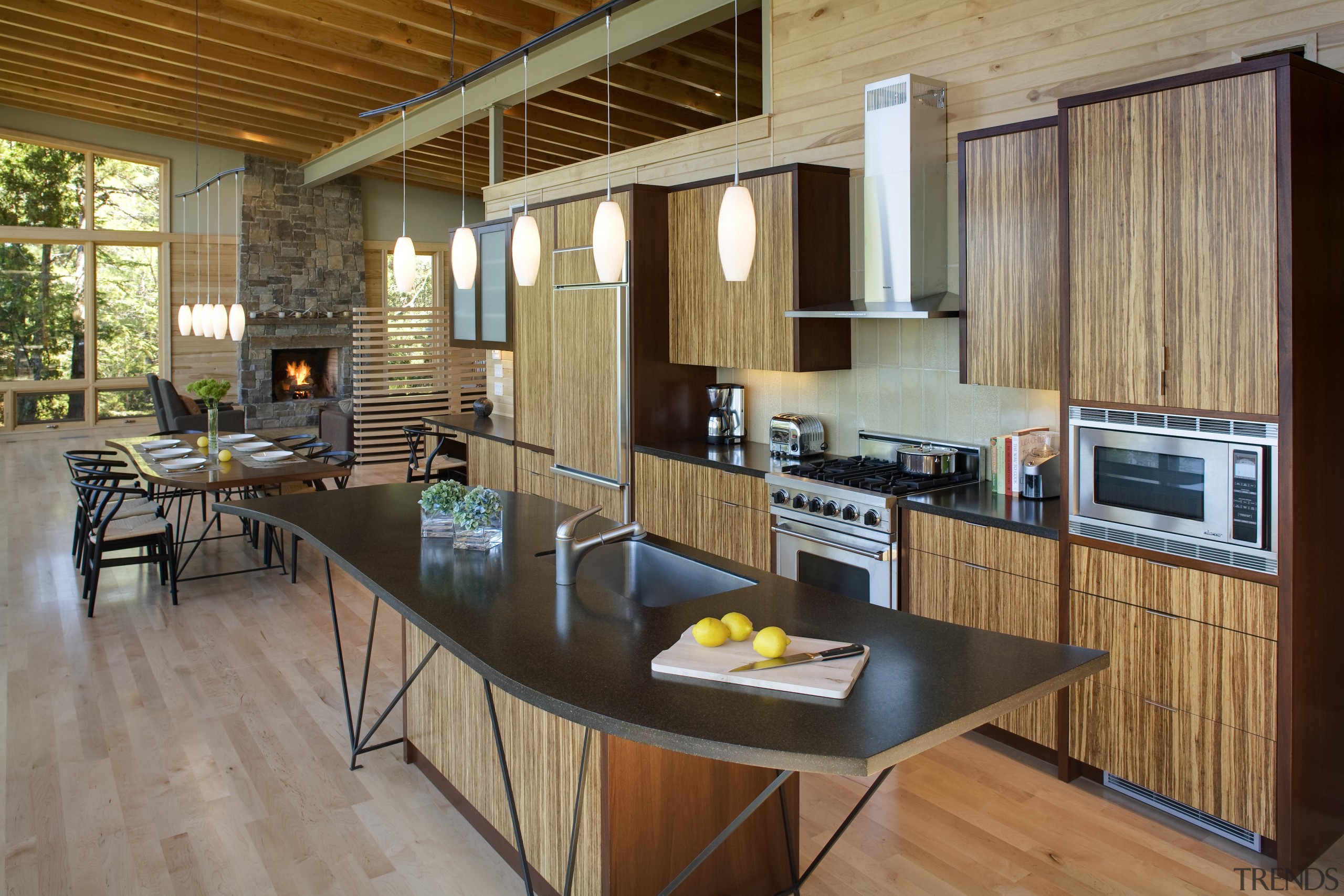 View of the kitchen spae which features 100% cabinetry, countertop, floor, flooring, hardwood, house, interior design, kitchen, real estate, wood, wood flooring, brown, gray