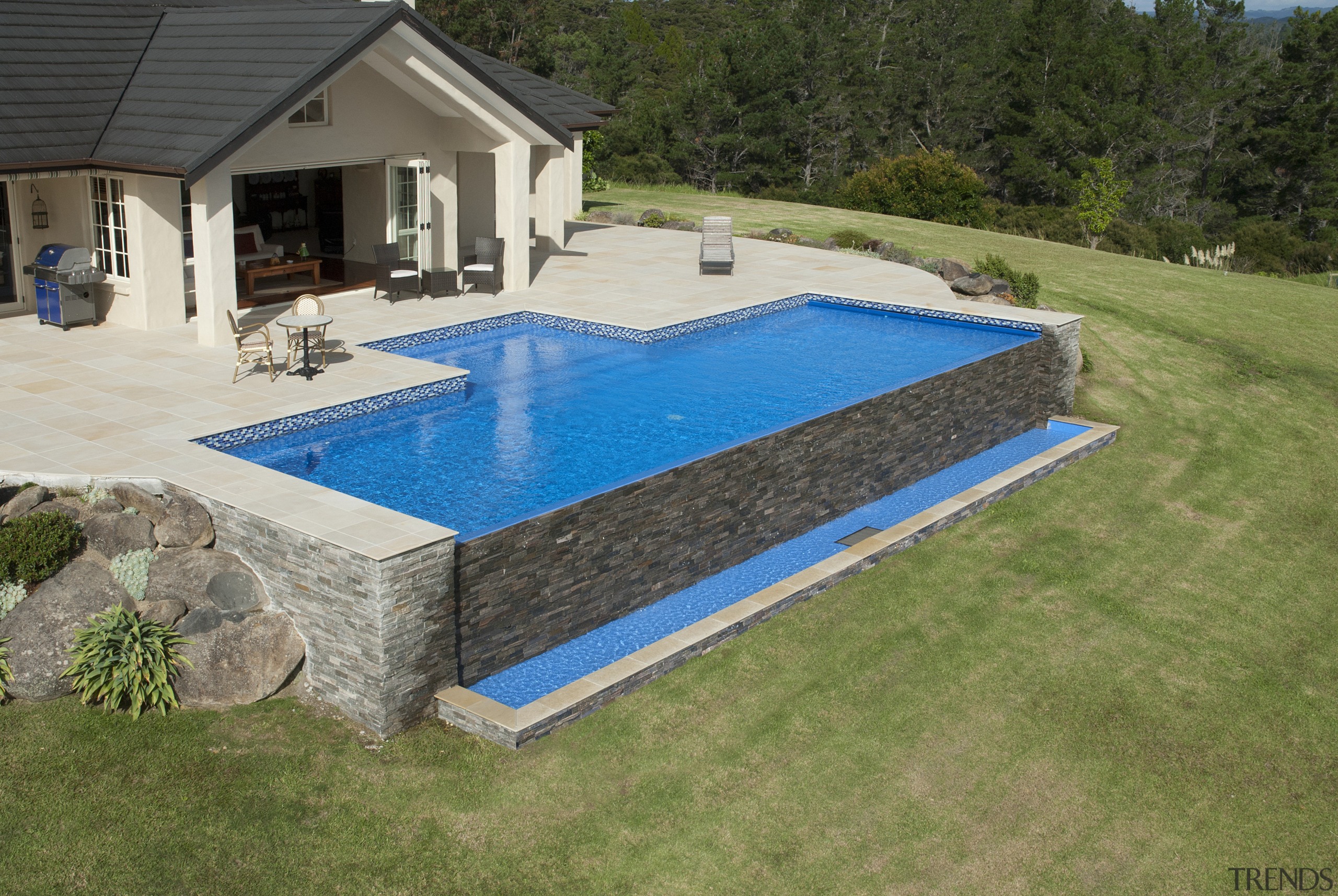 This is a view of the pool designed backyard, grass, leisure, property, real estate, swimming pool, yard, brown