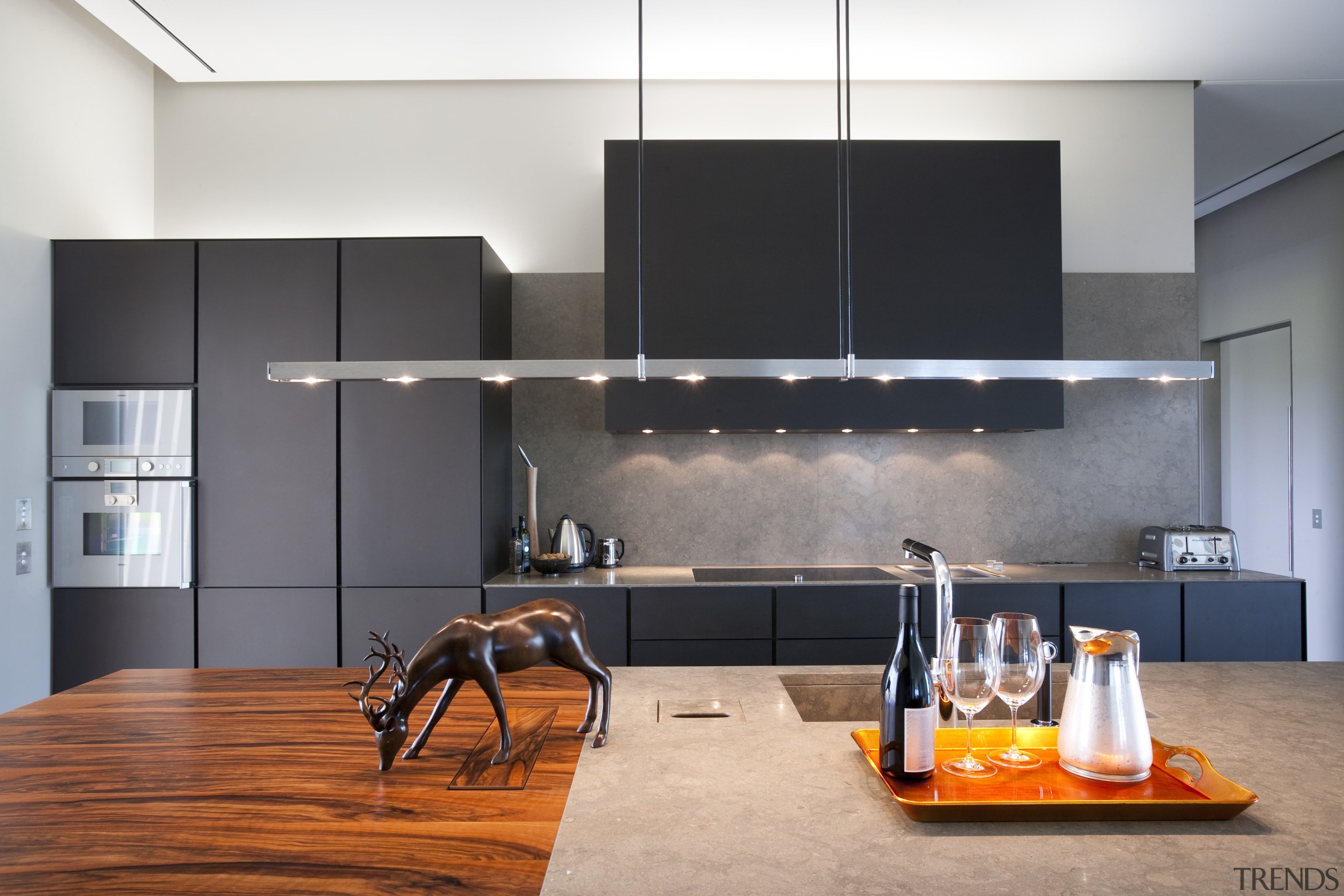 View of a contemporary kitchen which features island, interior design, kitchen, product design, gray