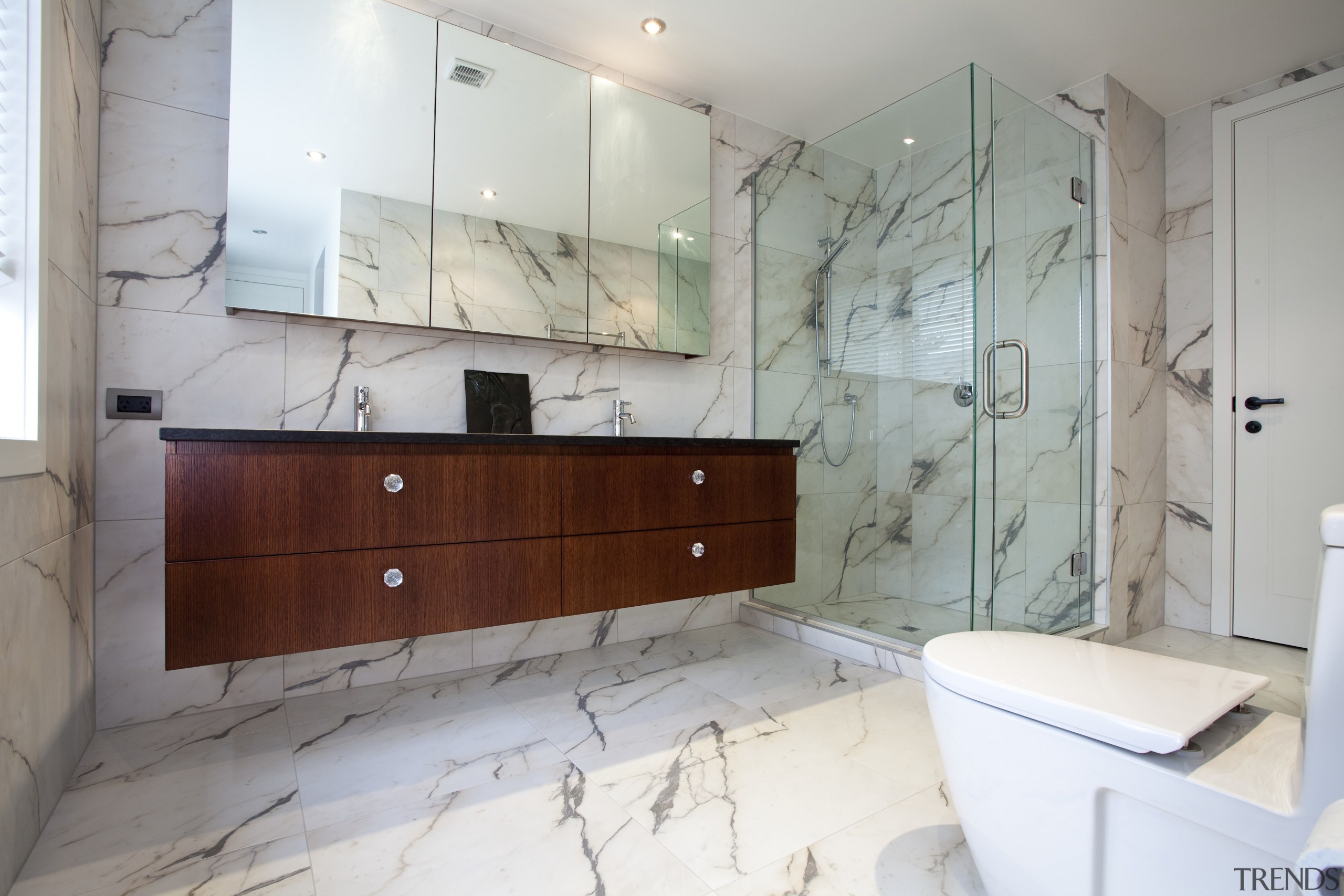 View of bathroom with marble-patterened porcelain tiles and bathroom, bathroom accessory, bathroom cabinet, floor, flooring, home, interior design, property, room, sink, tile, wall, gray, white