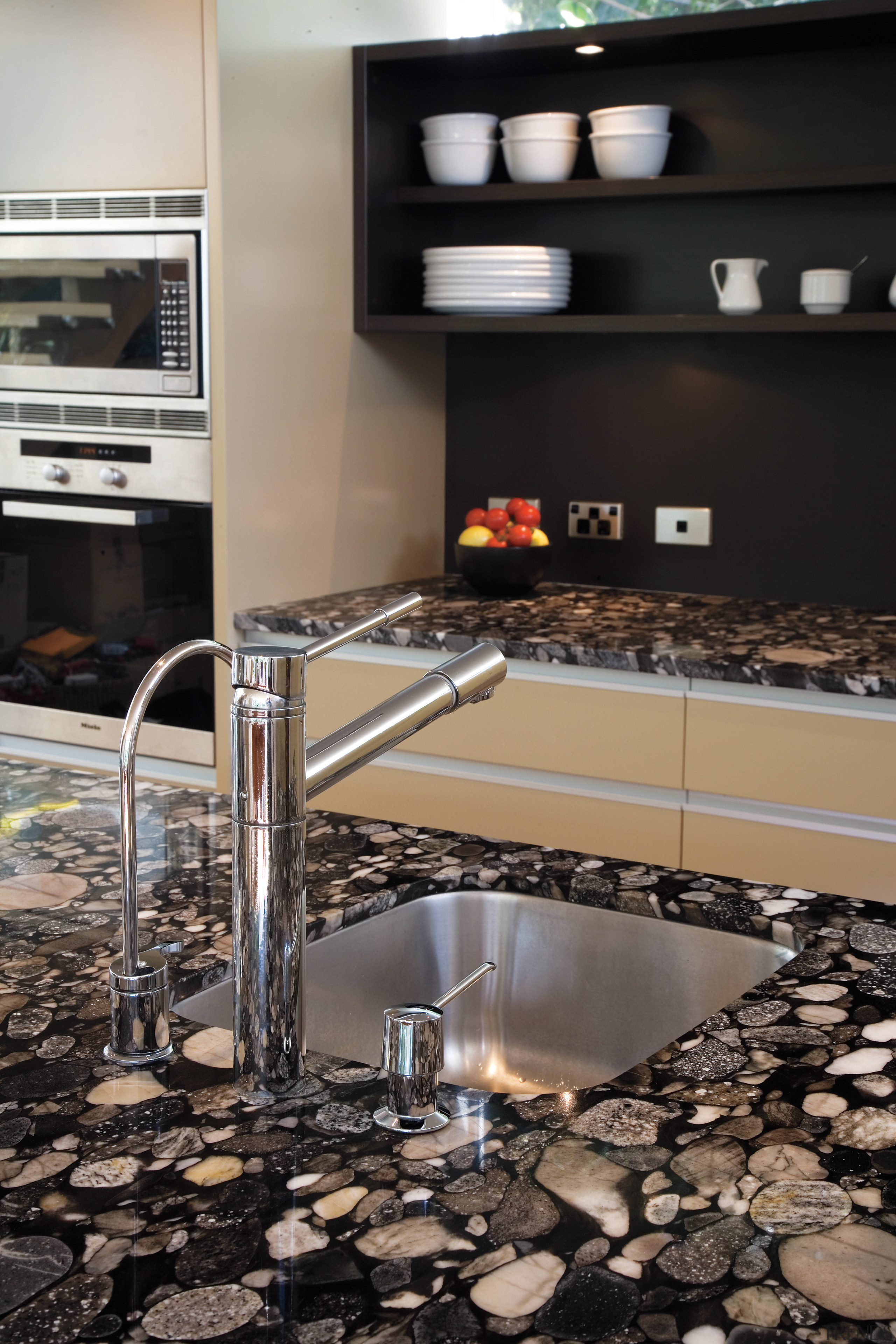 A view of this kitchen featuring polished timber countertop, floor, flooring, interior design, kitchen, tile, black, gray