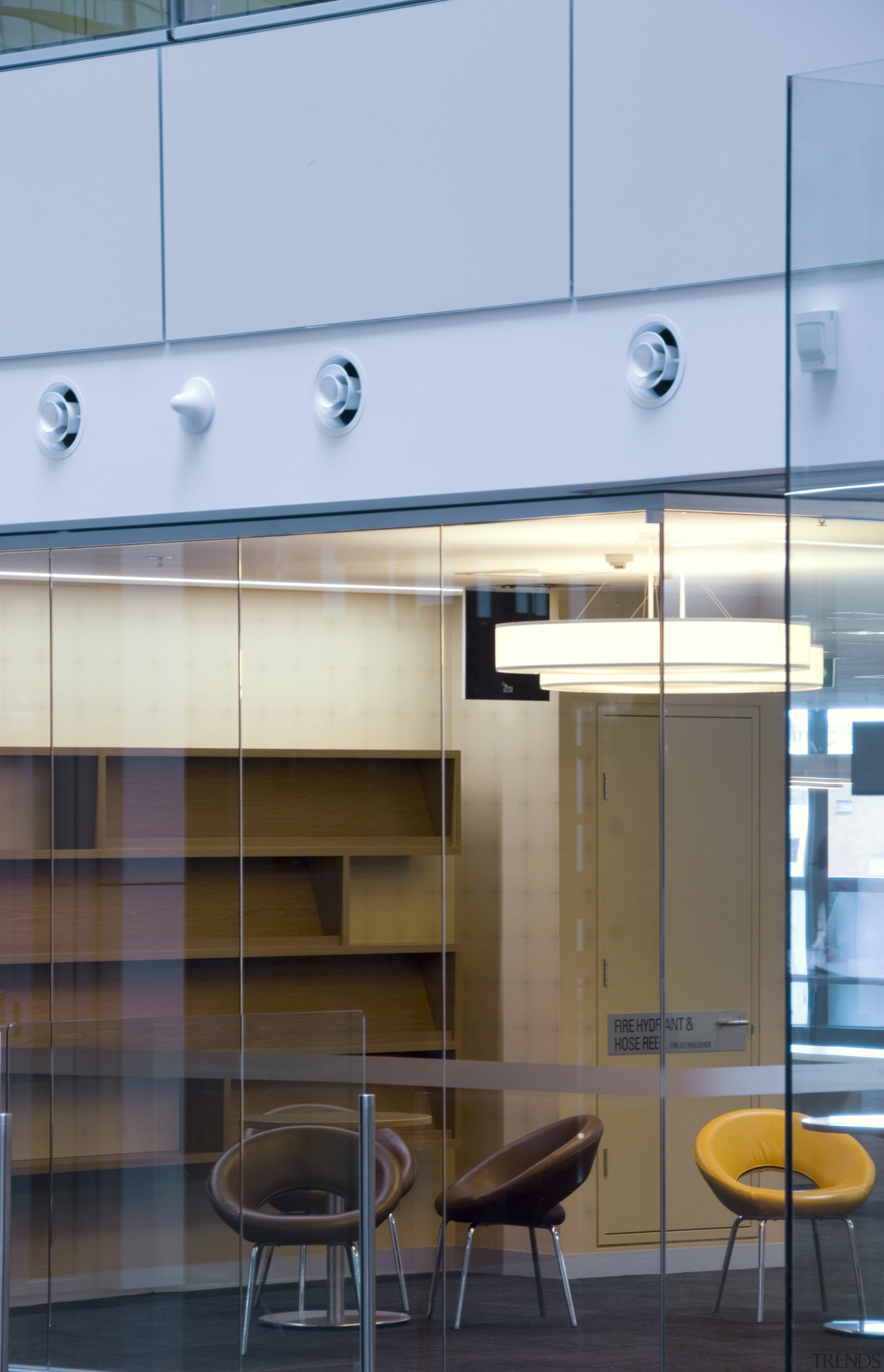 interior view of building featuring escalators, lighting, doors architecture, ceiling, daylighting, glass, interior design, wall, teal