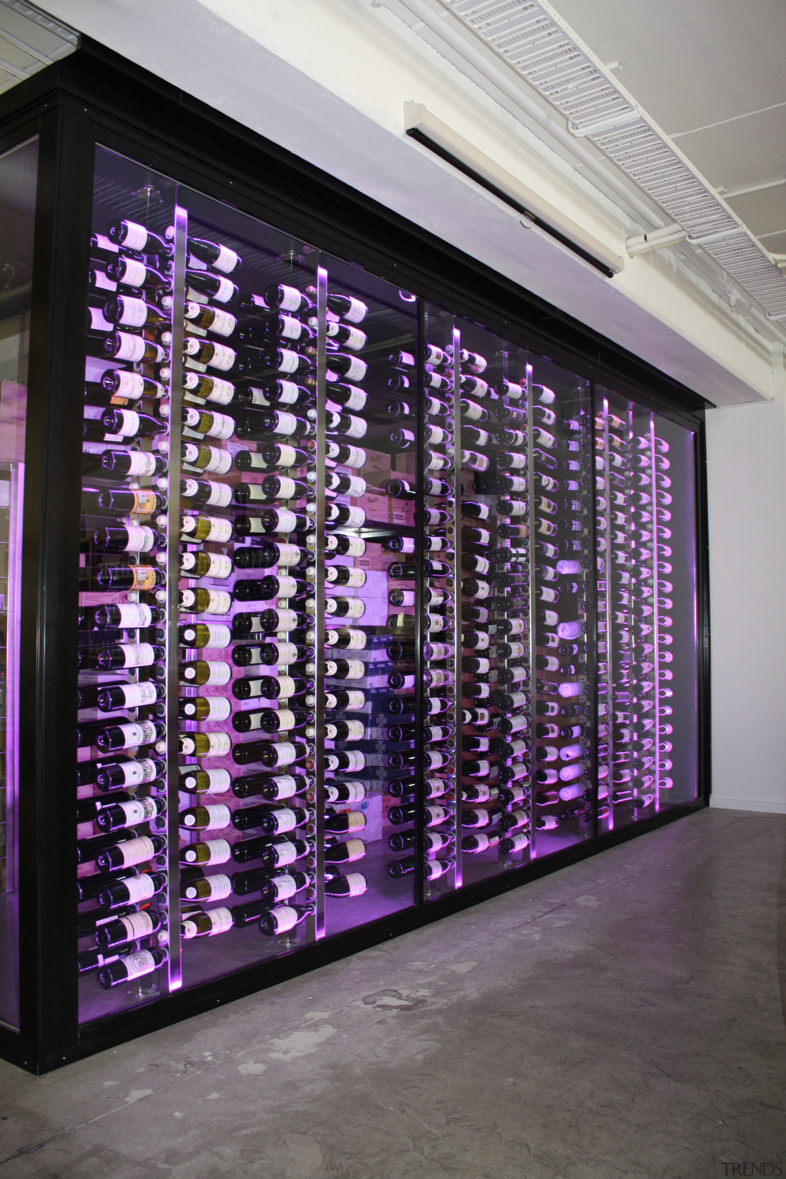 View of refrigeration solution at wine retailer. - display case, interior design, purple, gray