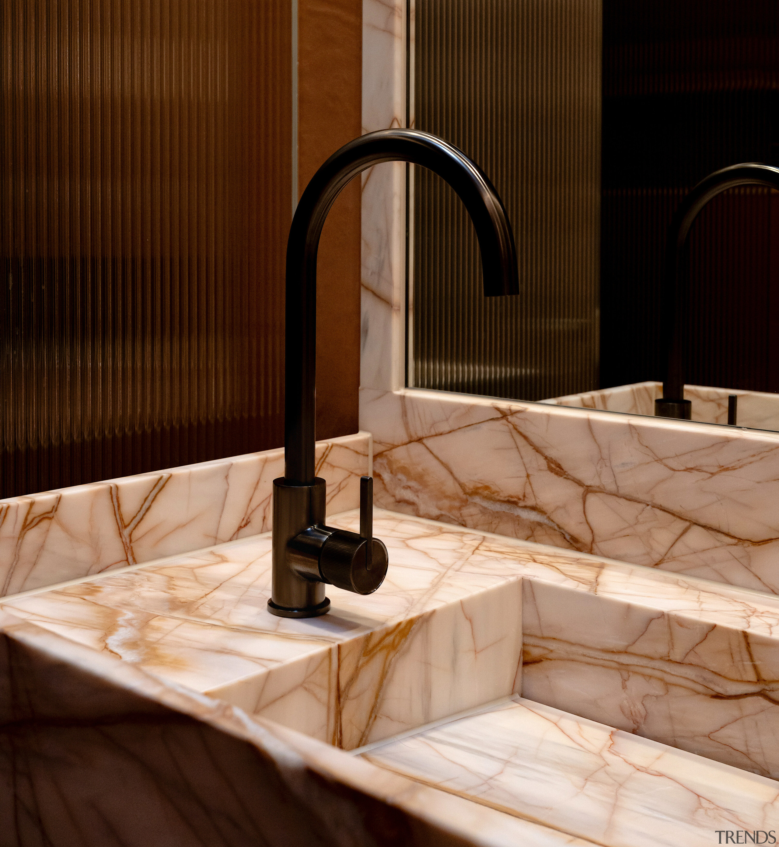 Gunmetal-finished mixer contrasts and complements the pink, beautifully 
