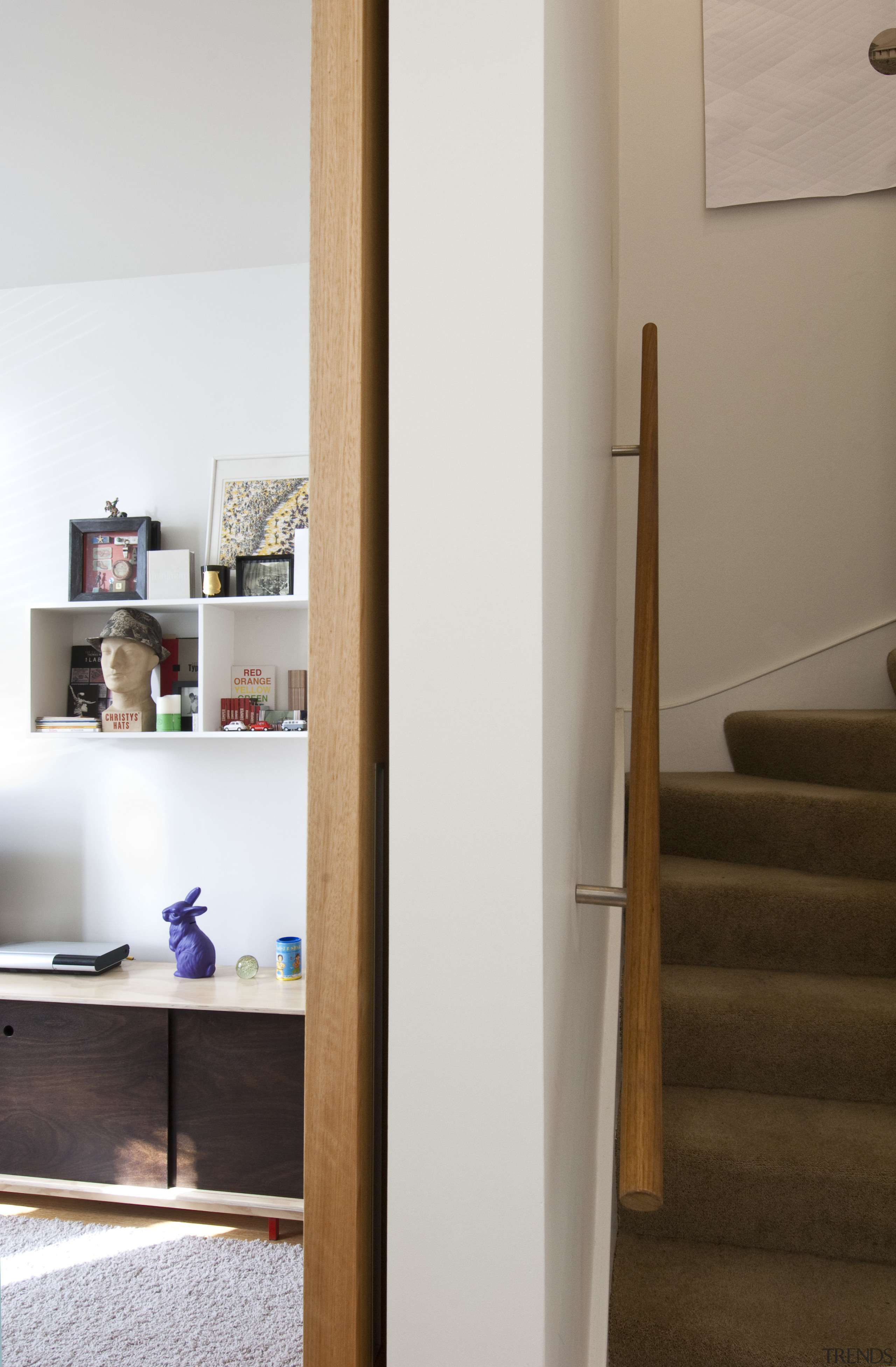 This home was renovated by Tse:Wallace Architects. Here furniture, interior design, light fixture, lighting, product design, shelf, shelving, wood, gray, brown