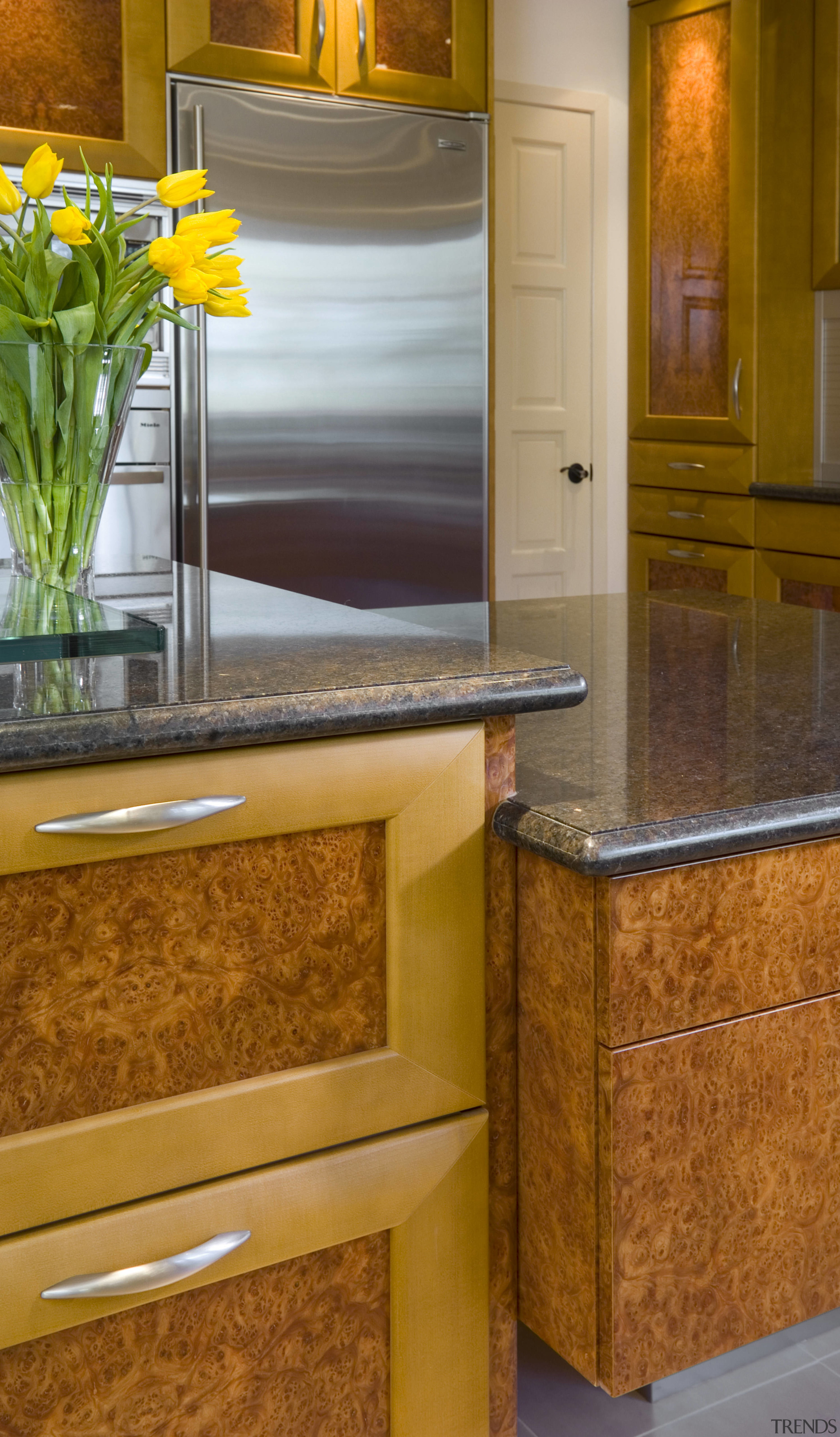 view of kitchen countertops and cabinetry. - view cabinetry, chest of drawers, countertop, drawer, floor, flooring, furniture, hardwood, interior design, kitchen, room, table, tile, wood flooring, wood stain, brown