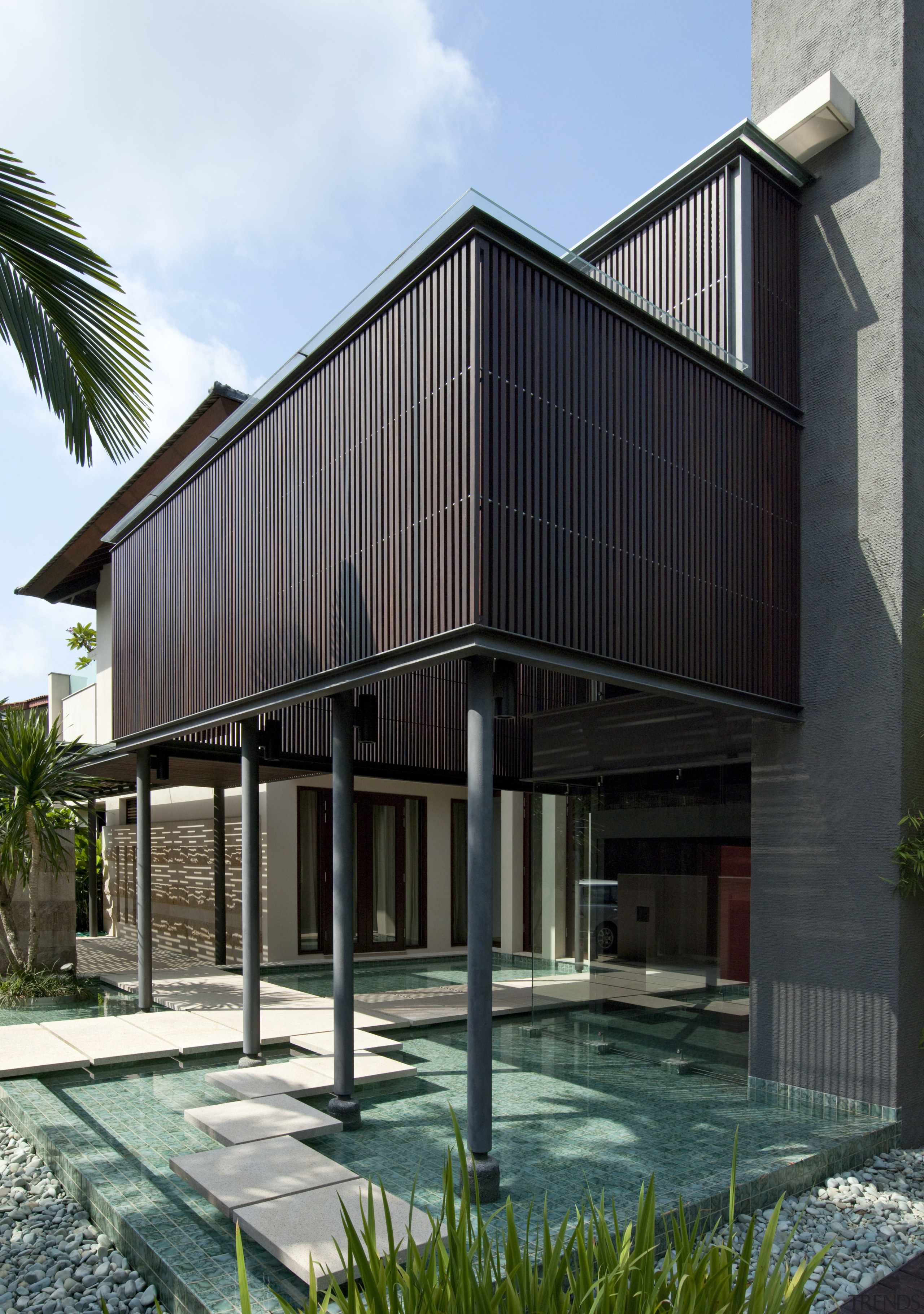 View of reflection pool with granite stepping stones. architecture, building, condominium, facade, home, house, property, real estate, residential area, siding, black