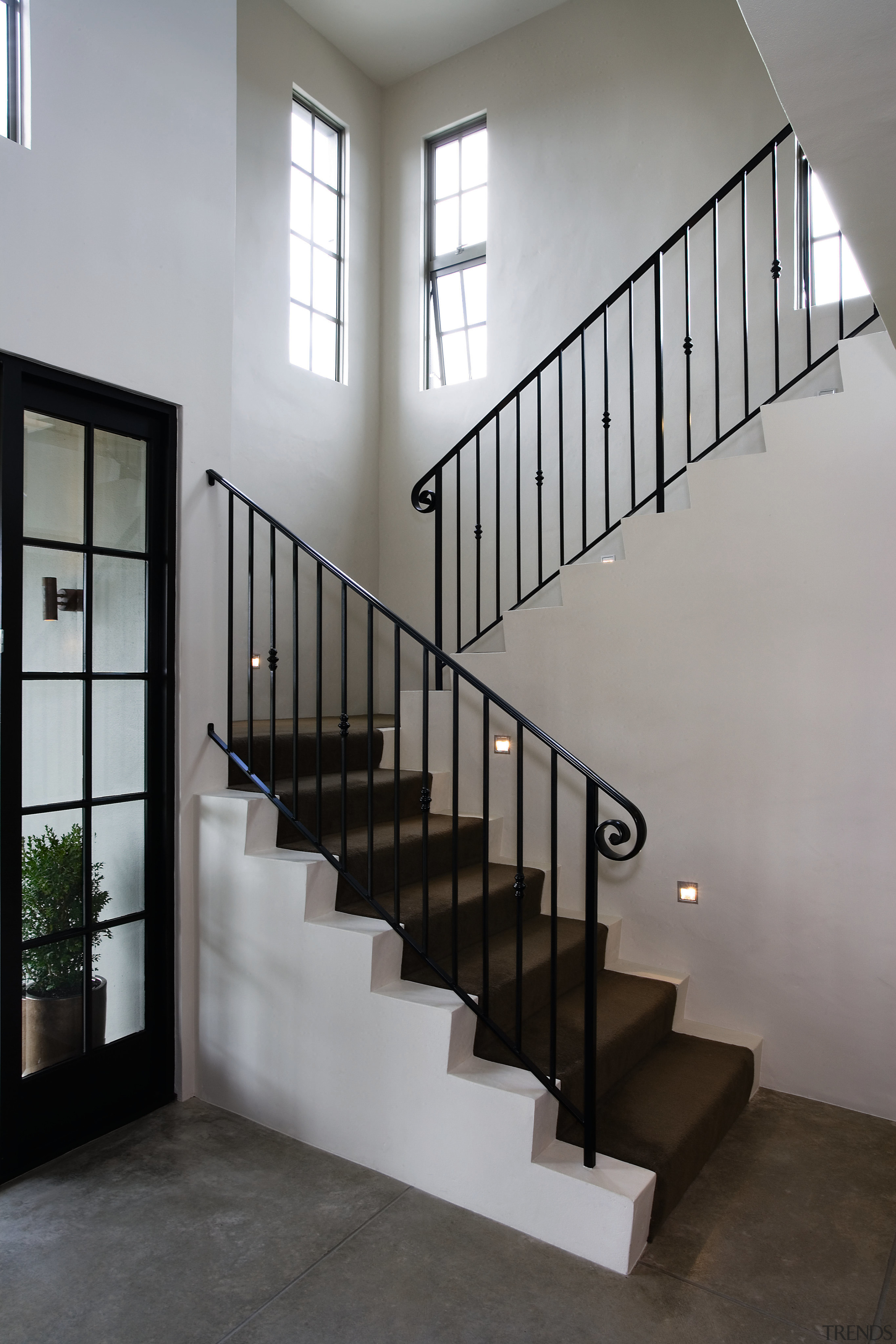 A view of some coloured concrete flooring by architecture, baluster, daylighting, glass, handrail, home, house, interior design, iron, stairs, structure, gray