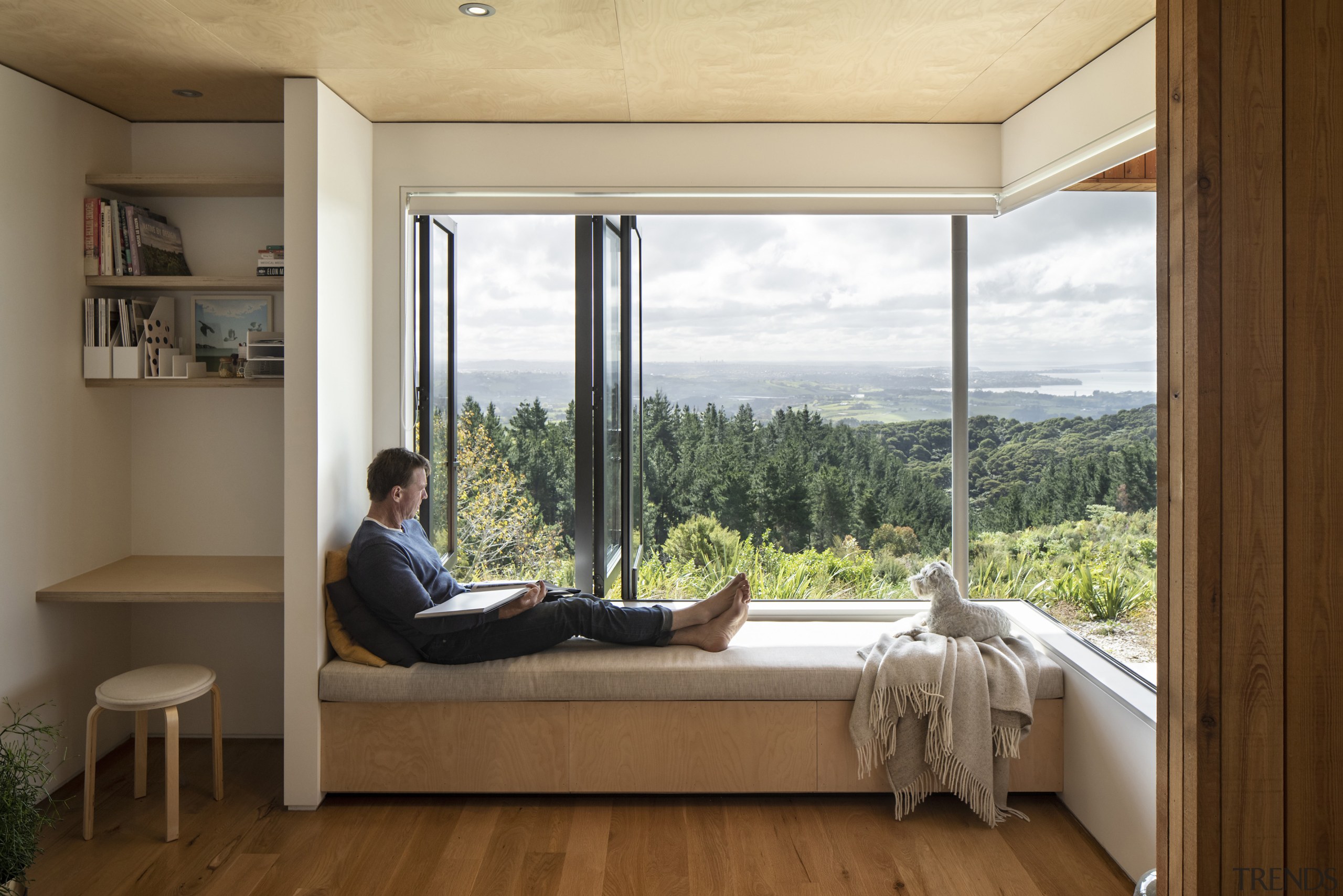 Here bench seating provides storage while bi-fold windows 