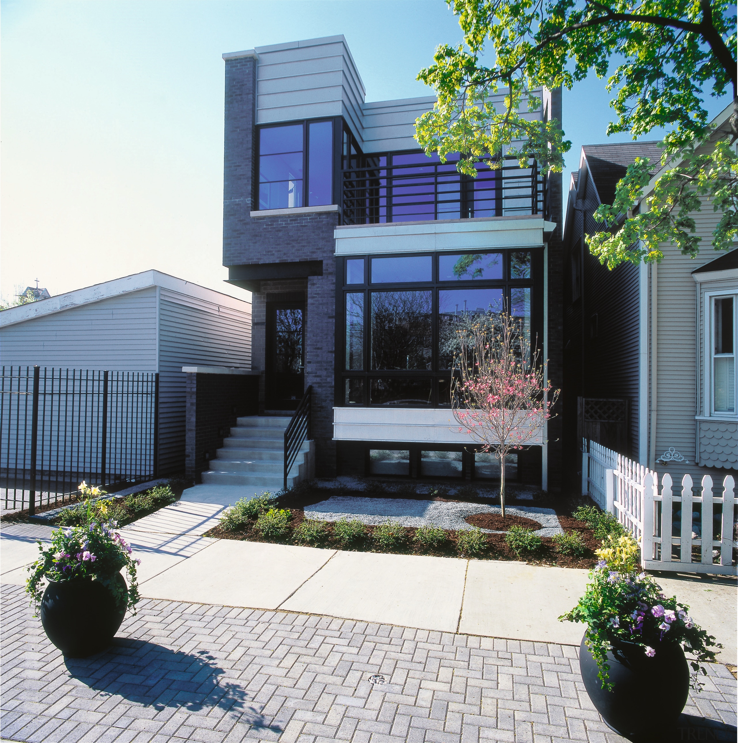 An exterior view of a wooden and brick architecture, backyard, building, elevation, facade, home, house, property, real estate, residential area, siding, yard, white